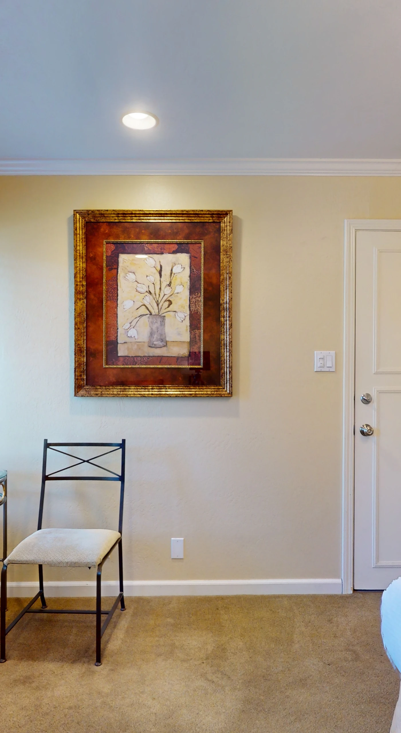 Tasteful artwork and a reading nook invite you to unwind in your Napa Valley bedroom — modern air conditioning keeps your suite perfectly comfortable year-round.