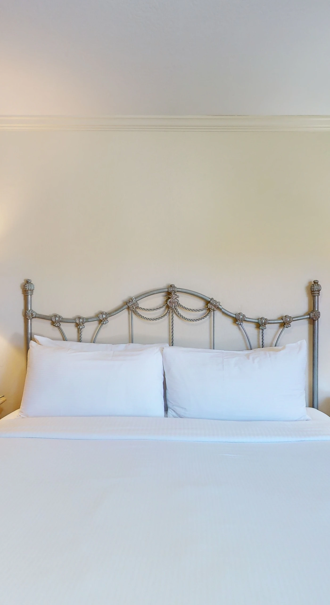Sink into crisp white bedding and plush pillows on your king bed — the perfect end to a Napa Valley wine tour