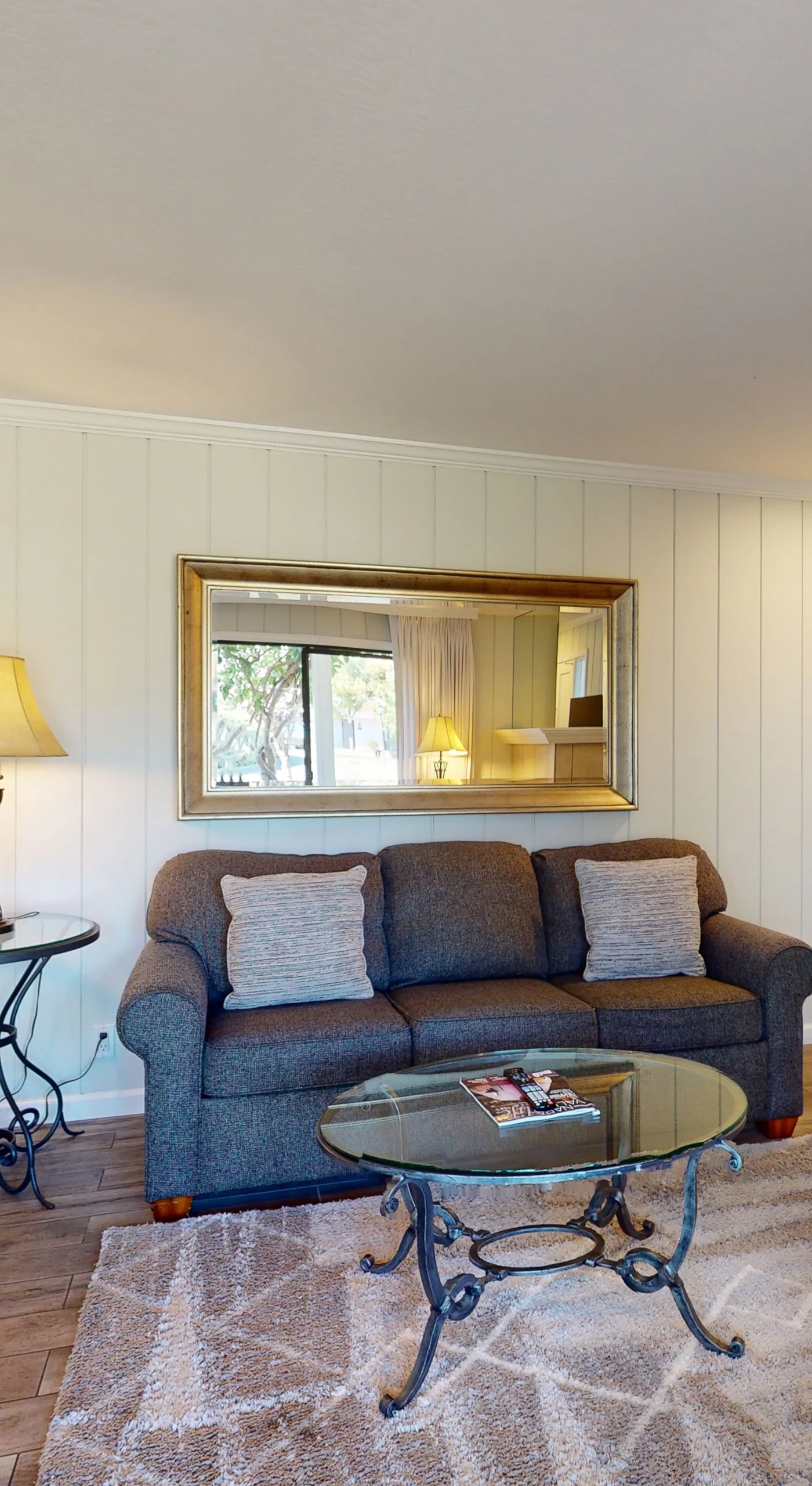 Cozy evenings await in your Napa hideaway — sink into the sofa beneath soft lamplight with a flat-screen TV ready for movie night.