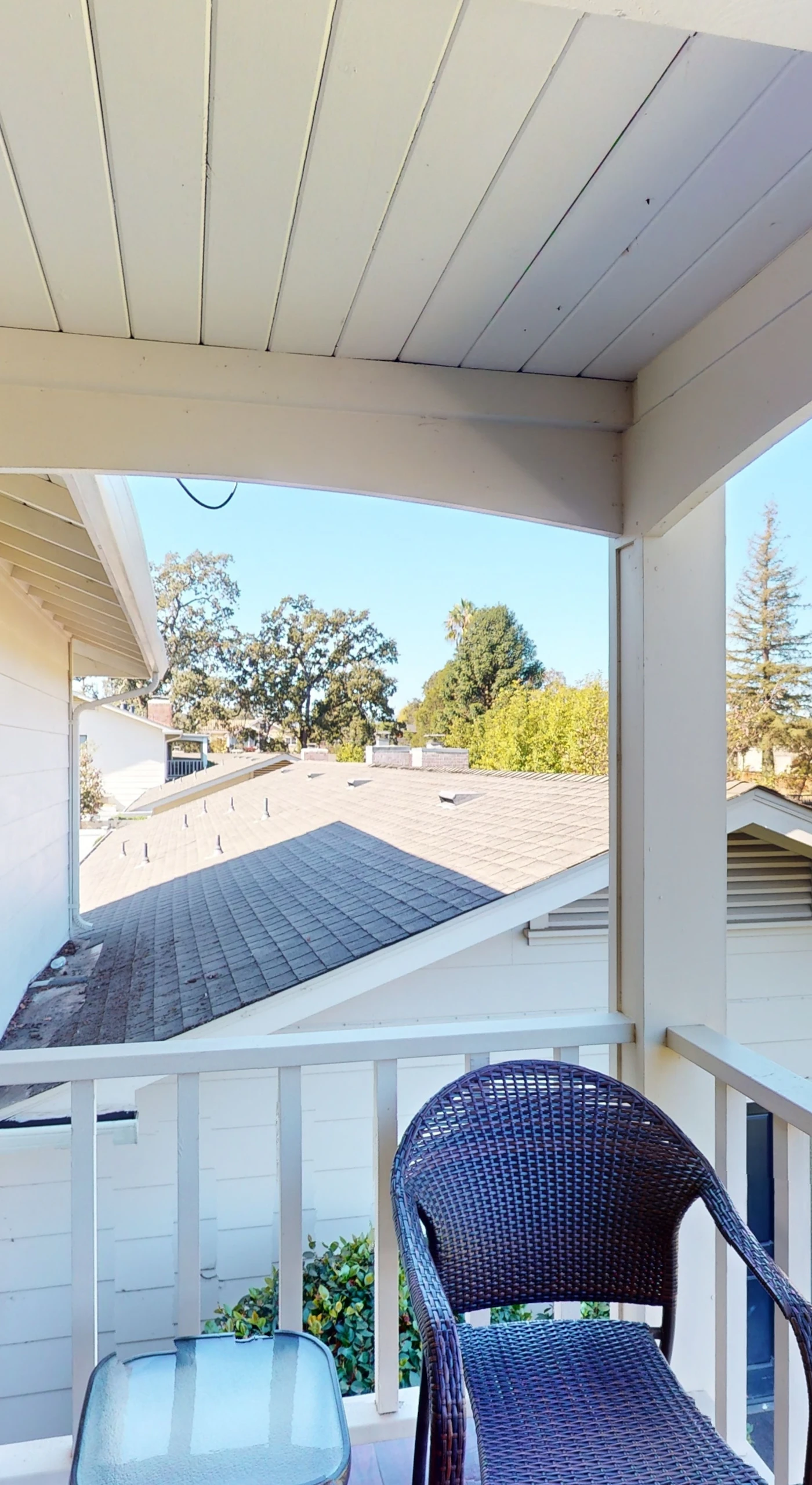 Savor your morning coffee on the covered balcony with wicker seating and views of the Silverado Resort treetops — a peaceful Napa start to every day.