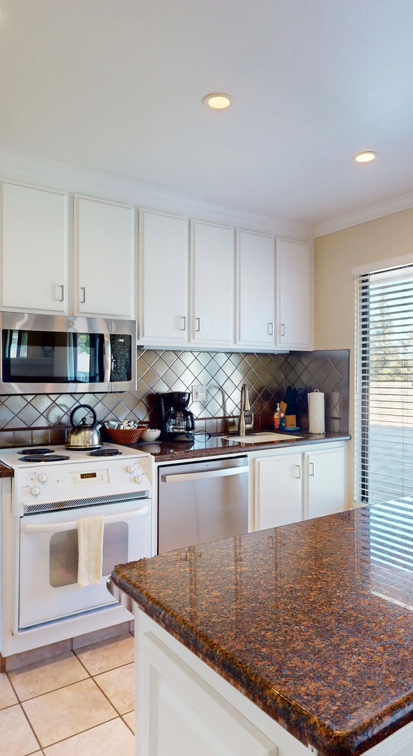 Prep your farm-to-table finds in the full kitchen featuring granite counters, a stove, microwave, coffee maker, and everything you need for a Napa feast.