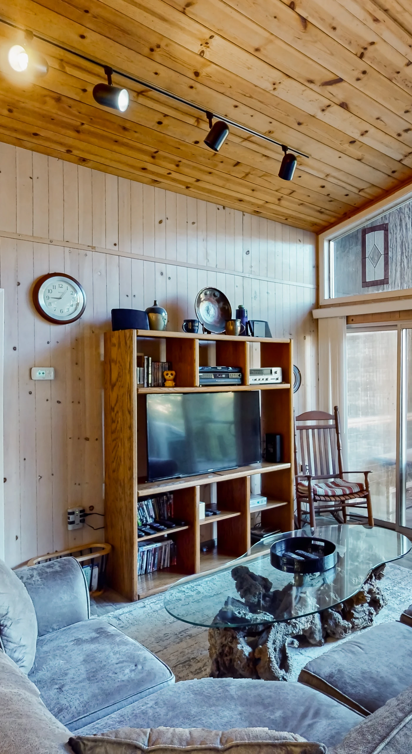 Gather under soaring knotty-pine ceilings where handcrafted stained glass catches the afternoon light — your wine country living room among the redwoods.