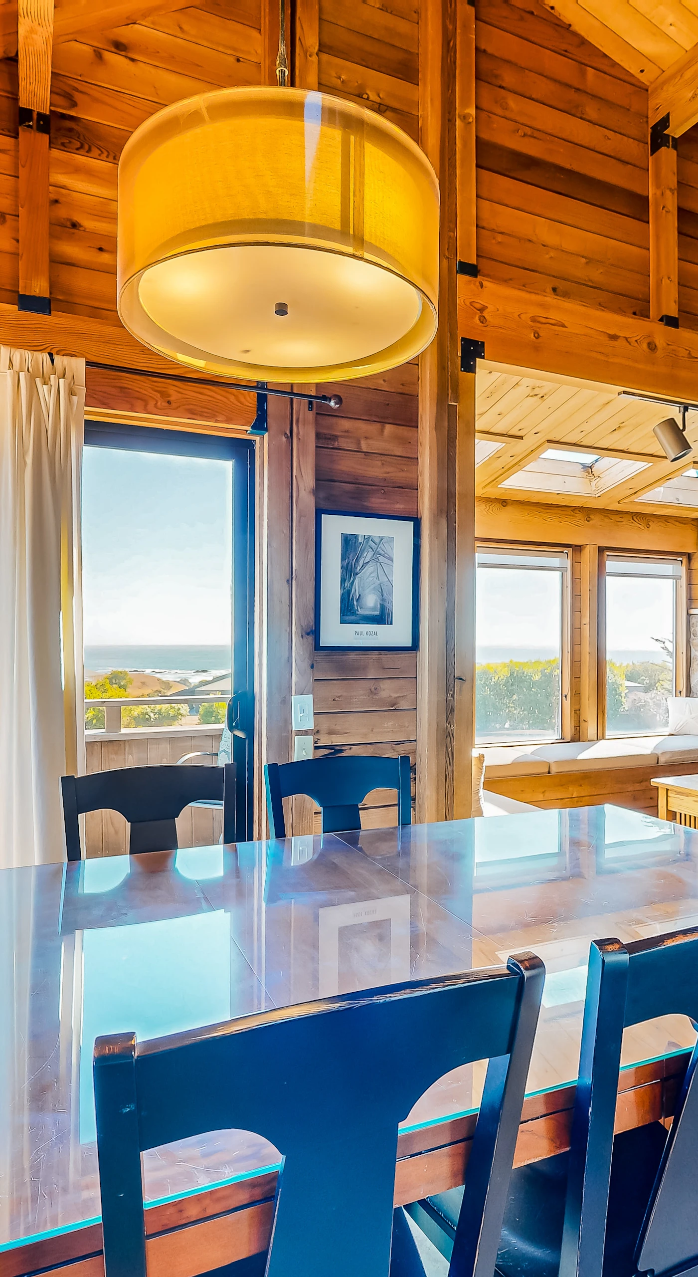 Savor your morning coffee at this dining area, where sunlight dances through the windows and the ocean calls.