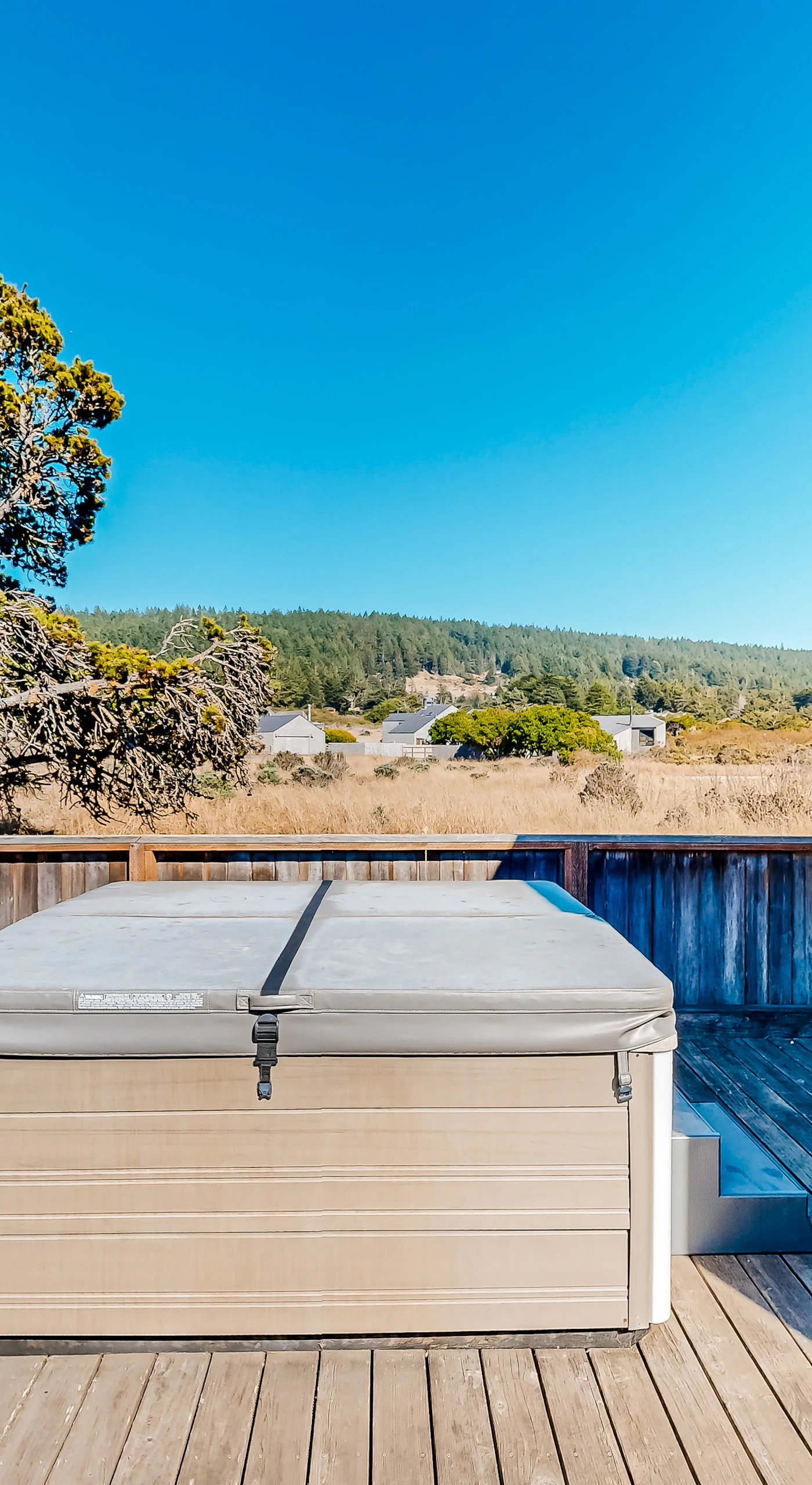 Soak in the private hot tub, surrounded by tranquil views, perfect for stargazing after a day of adventure.