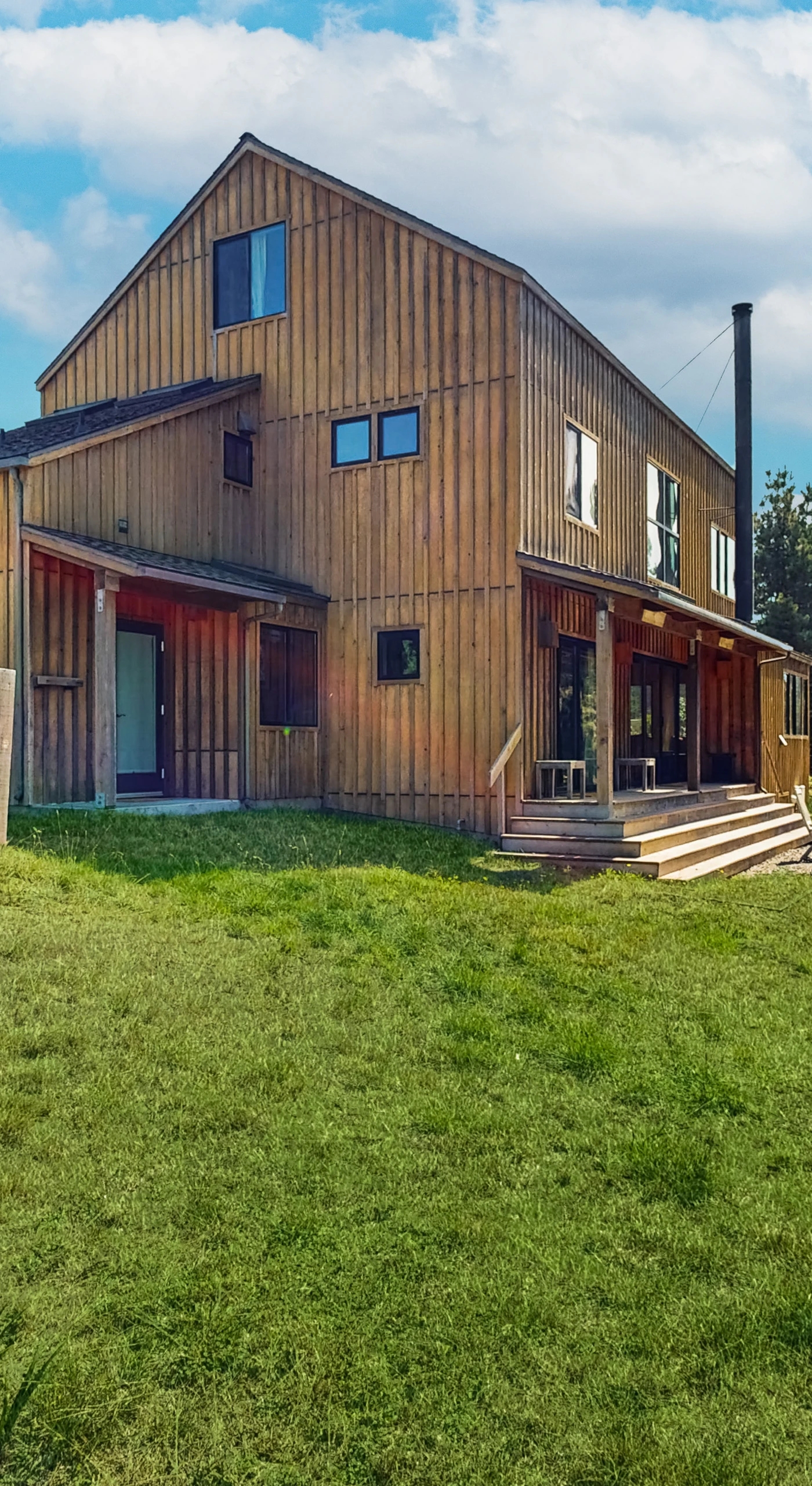 The inviting exterior welcomes you to Ocean Pines Lodge, where natural beauty and modern comfort blend seamlessly for your getaway.