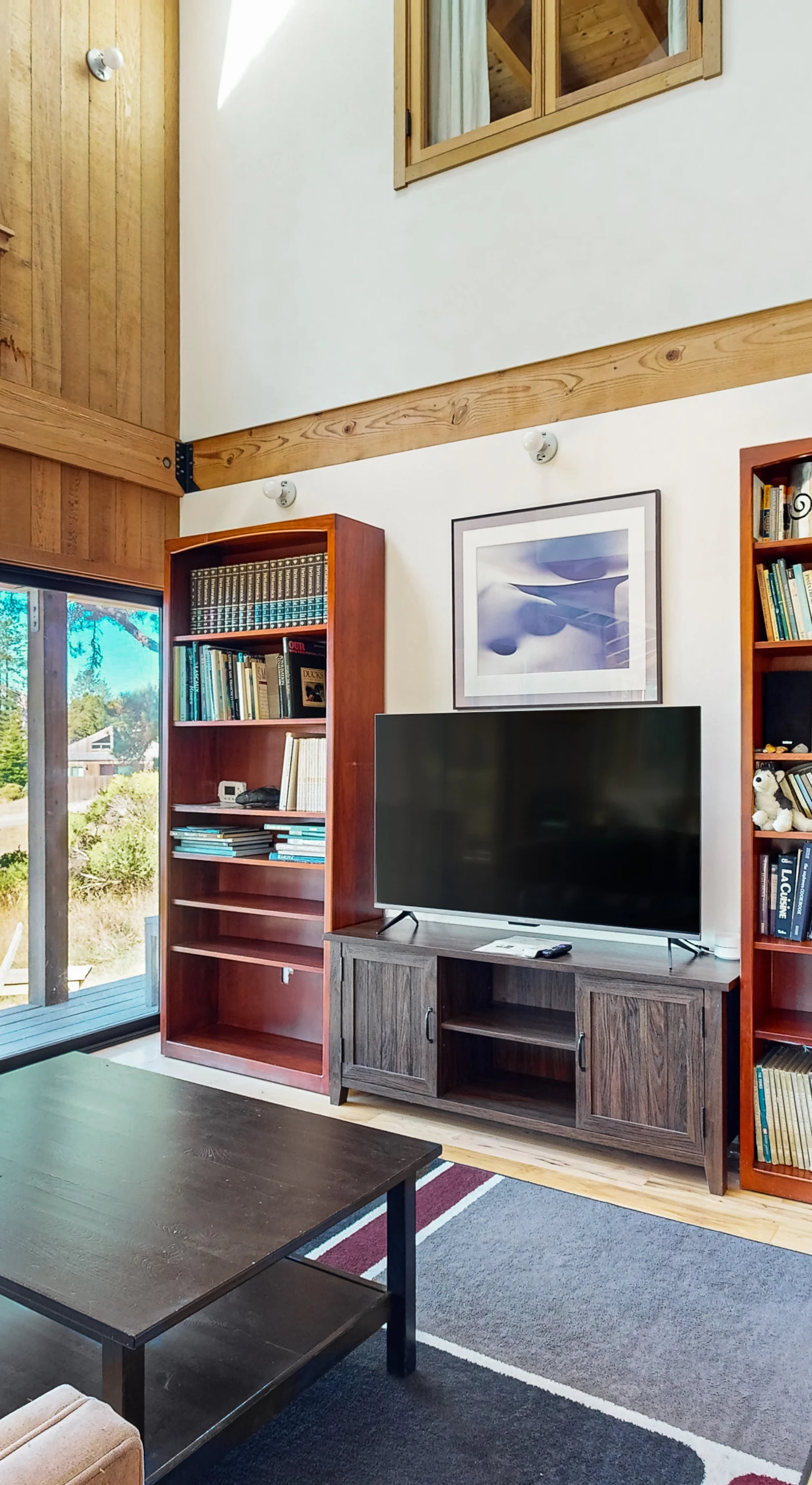 Relax in this serene living space, where books and entertainment await after a day of exploring the coast.