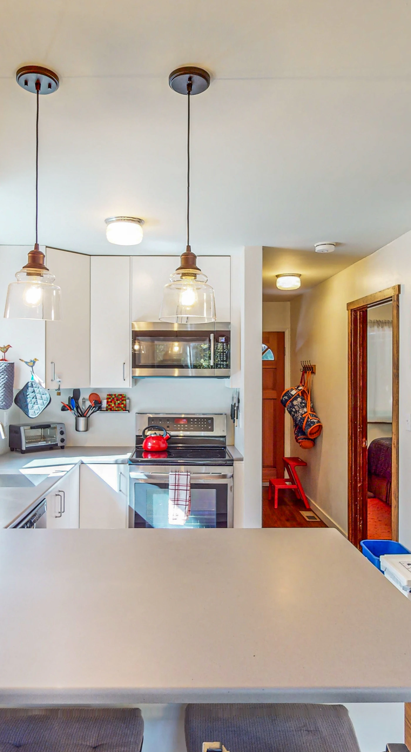 Whip up farm-to-table feasts in your fully equipped kitchen — ample counter space and pendant lighting make cooking feel effortless.