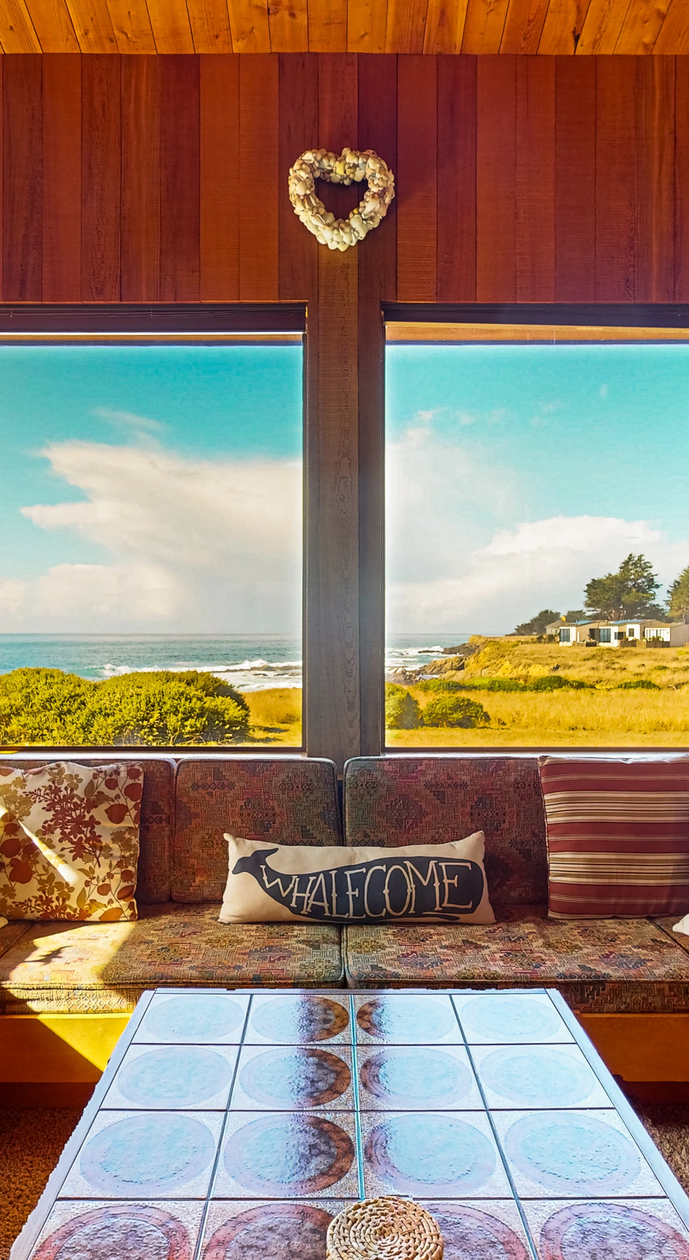 Feel the coastal charm as you relax on the inviting sofa, surrounded by panoramic views that make every moment special.