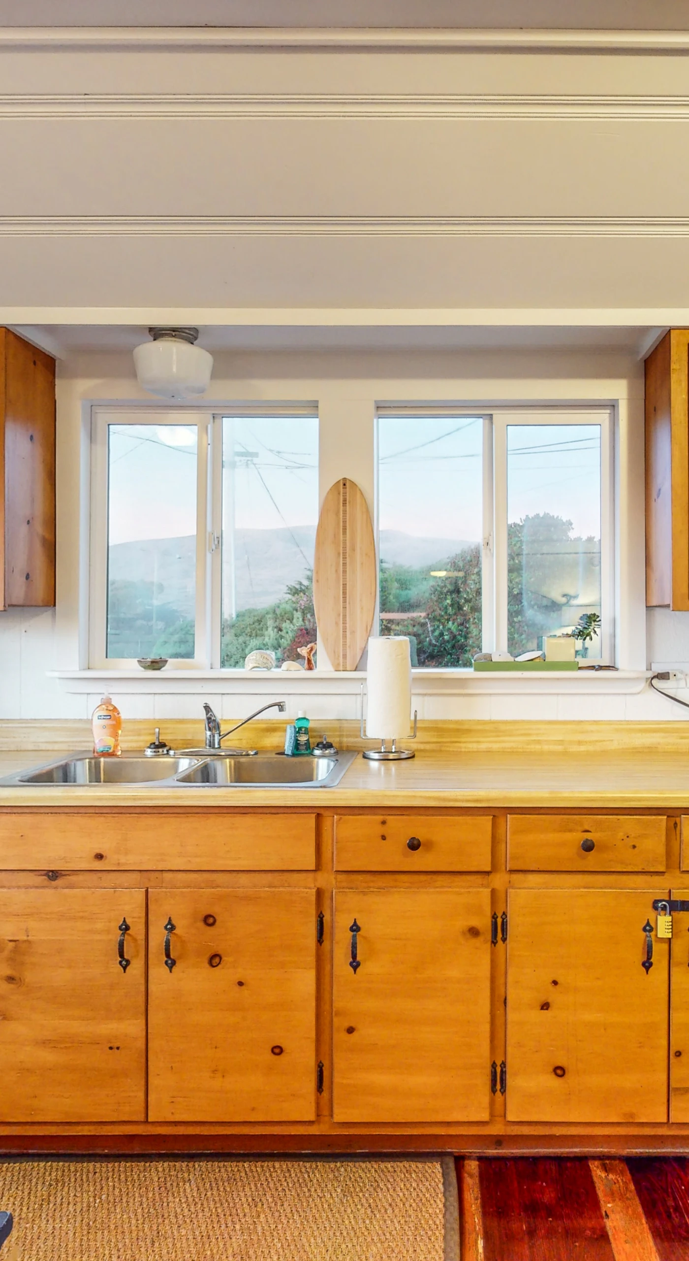 Brew your morning coffee with a view in this fully equipped Bodega Bay kitchen — warm wood cabinetry and everything you need to cook fresh Sonoma County fare.