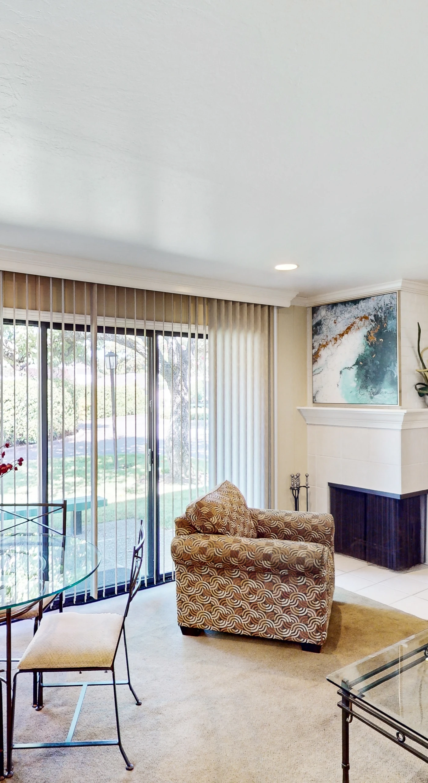 Gather around the glass dining table or lounge by the TV in your open-concept living space, with sliding doors framing views of Silverado's lush Napa Valley grounds.