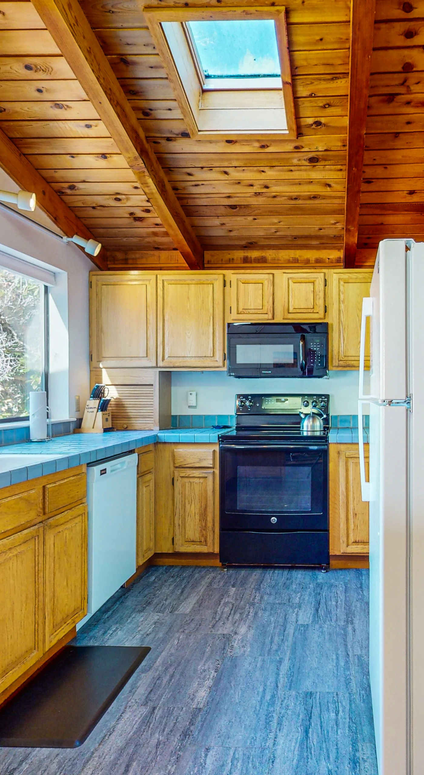 Cook up delicious meals in the well-equipped kitchen, where natural light and a spacious layout inspire culinary creativity.
