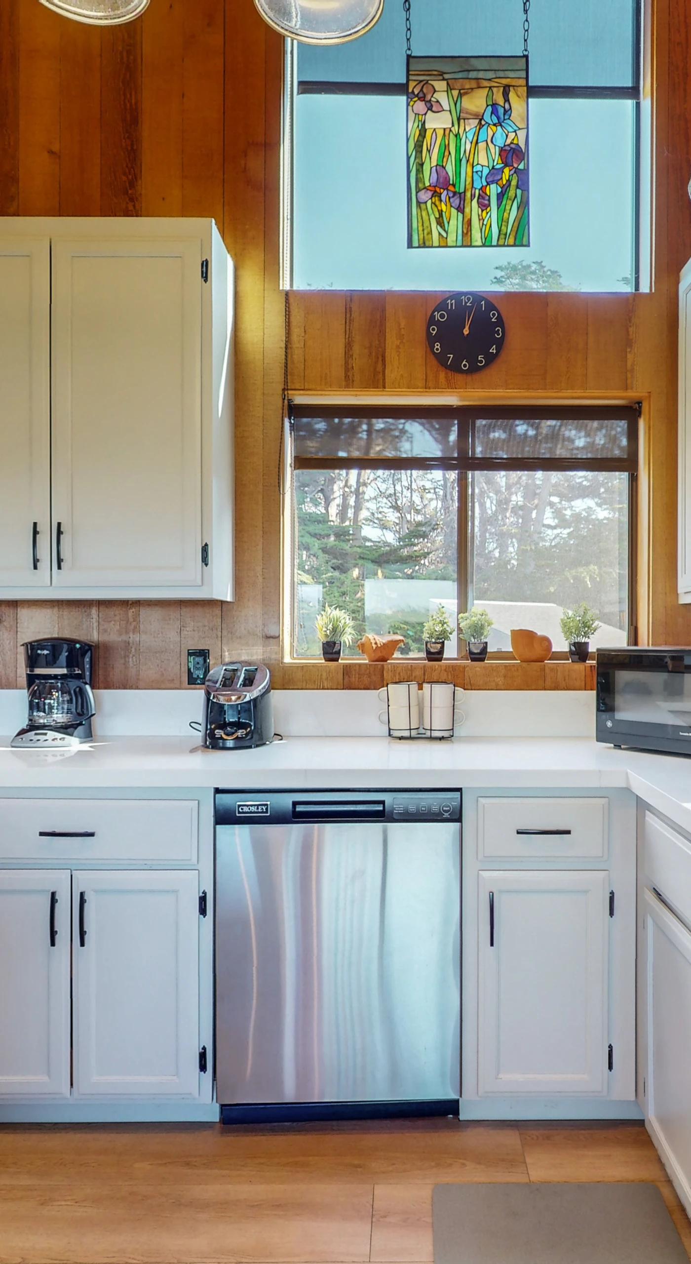 Cook culinary delights in this well-equipped kitchen, where natural light pours in, making meal prep a joyful experience.