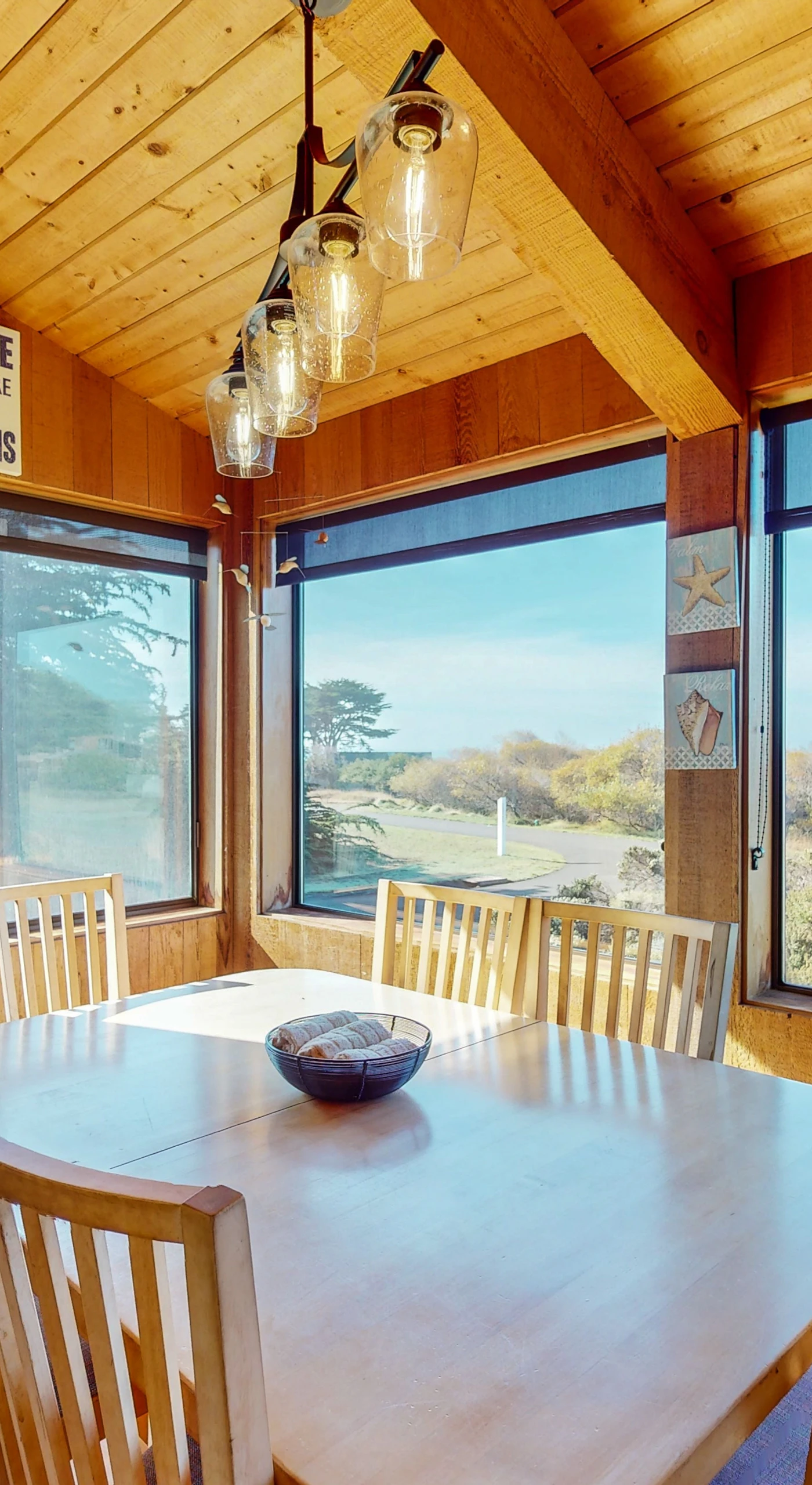 Dine with a view! The dining area features large windows that frame the picturesque landscape, creating a memorable setting for family meals.