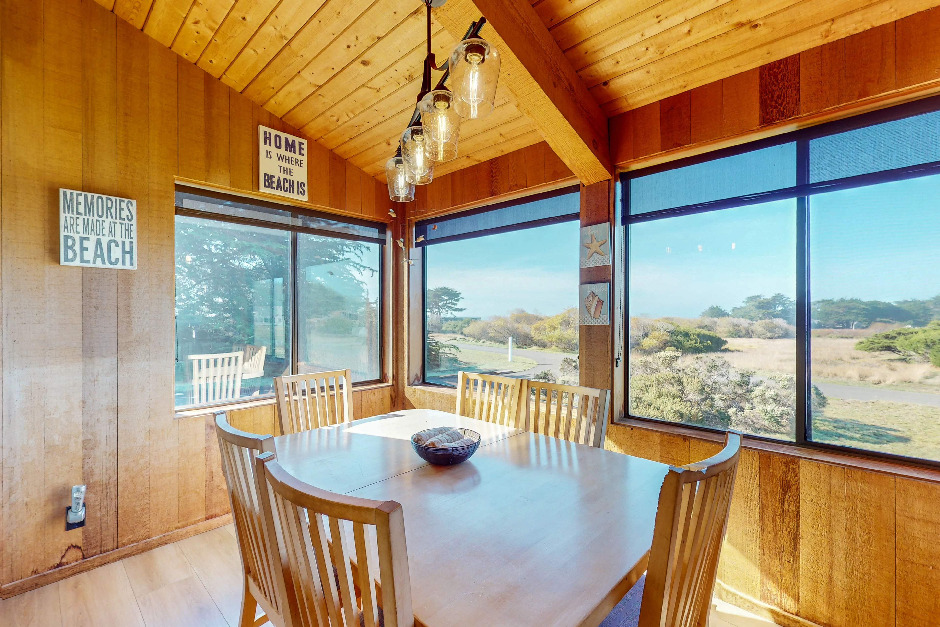 Dine with a view! The dining area features large windows that frame the picturesque landscape, creating a memorable setting for family meals.