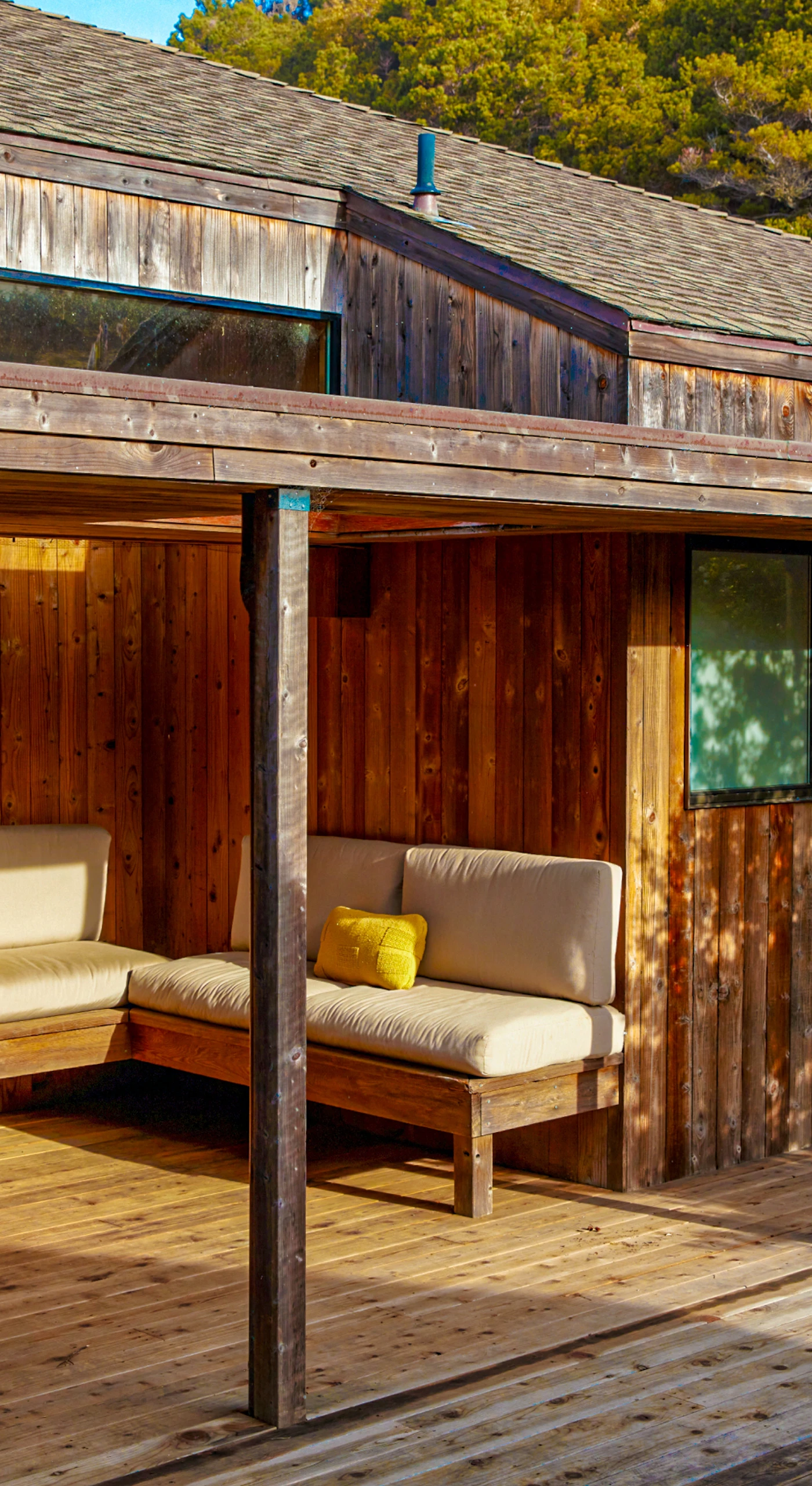 Unwind in your outdoor sanctuary, where cozy seating invites you to sip morning coffee amidst the beauty of nature.