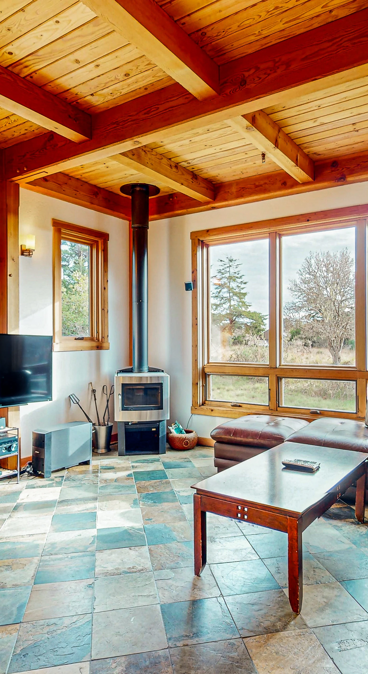 With cozy seating and a wood-burning fireplace, this living room invites you to unwind after a day of adventure, all while soaking in the peaceful atmosphere.