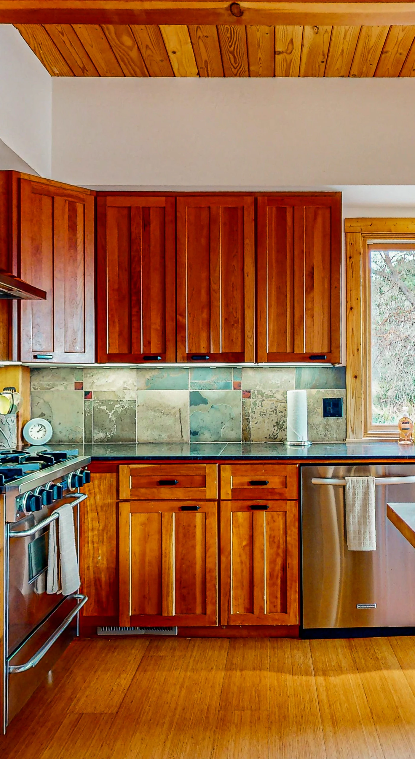 Your culinary creations come to life in this well-appointed kitchen, featuring modern appliances and ample counter space, perfect for preparing a feast.