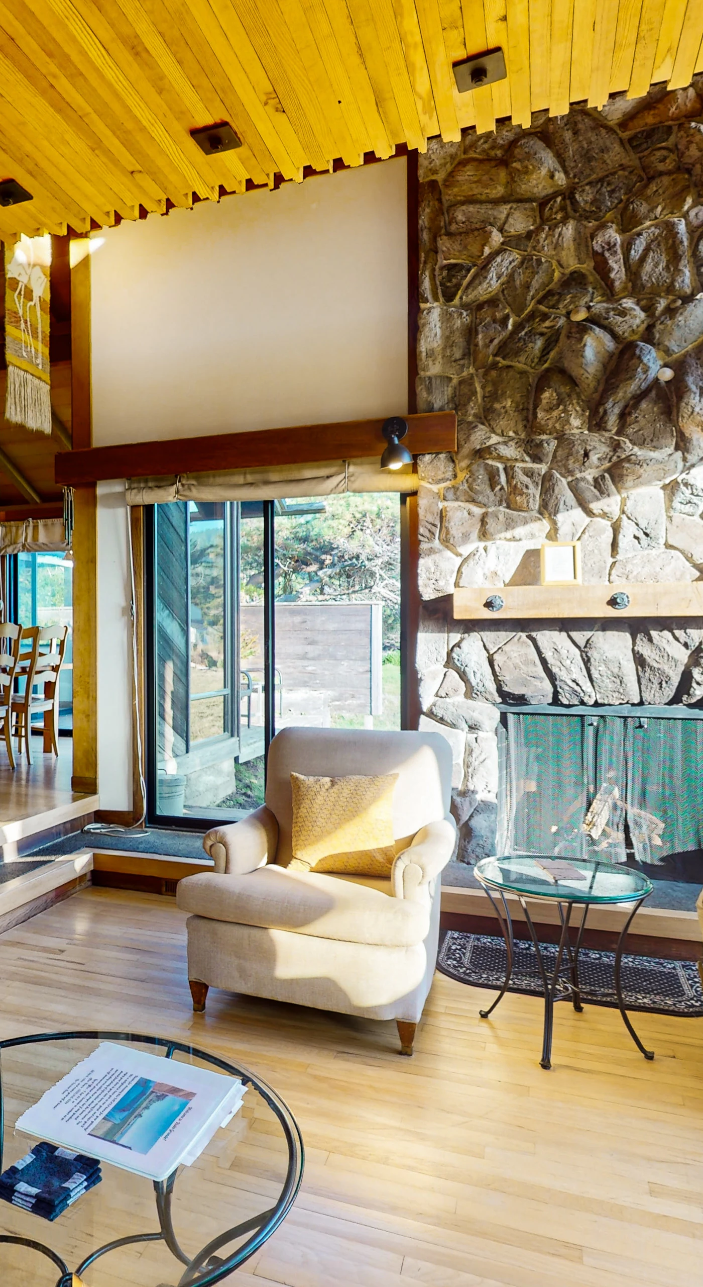 Gather around the stunning stone fireplace in this spacious living area, ideal for sharing stories after a day of adventure.