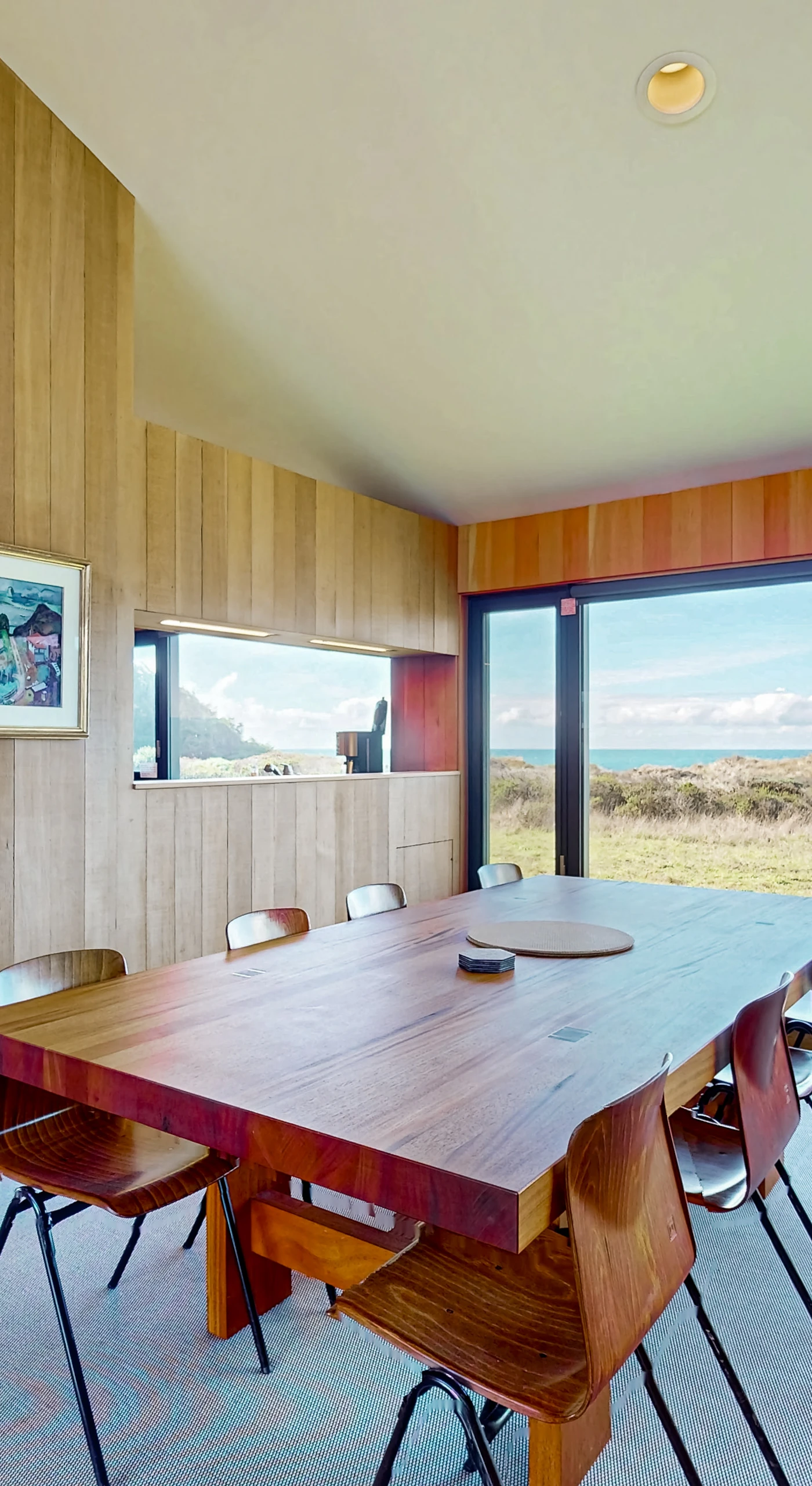 Gather around the dining table as natural light pours in, creating a warm and inviting atmosphere for shared meals and laughter.