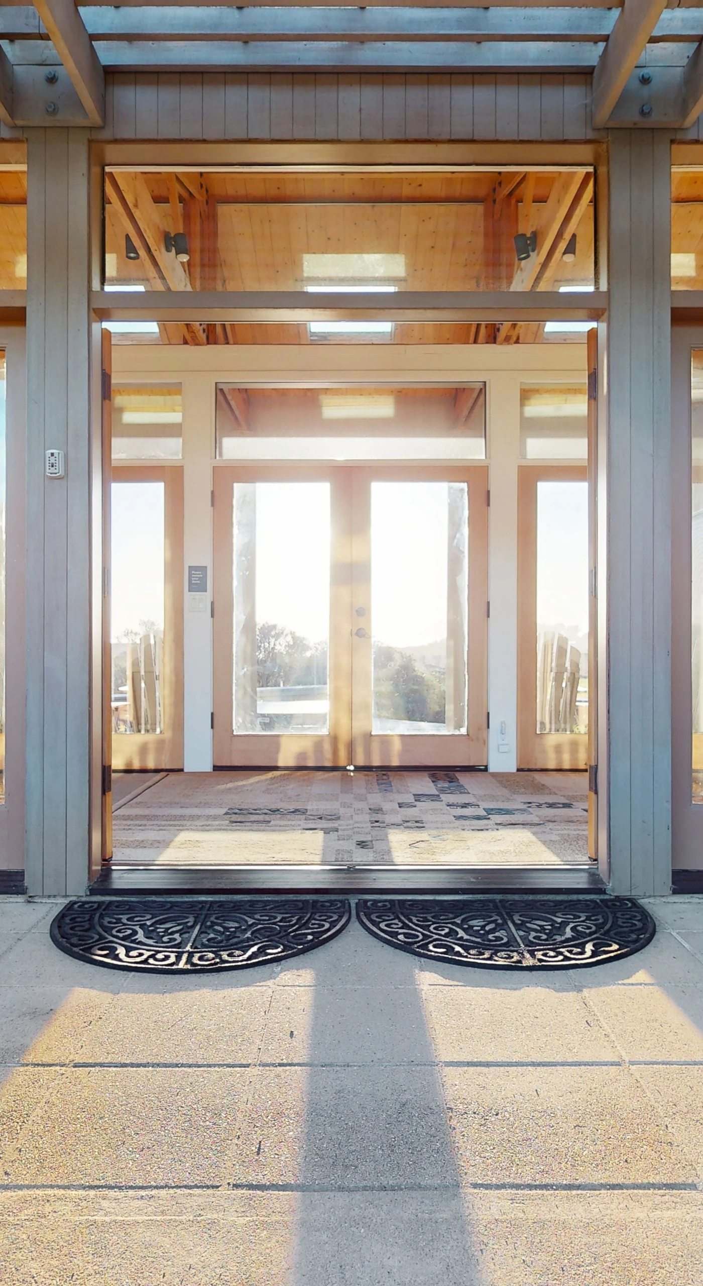 Step into a warm welcome at Del Mar Meadow, where the inviting entryway sets the tone for your coastal retreat.