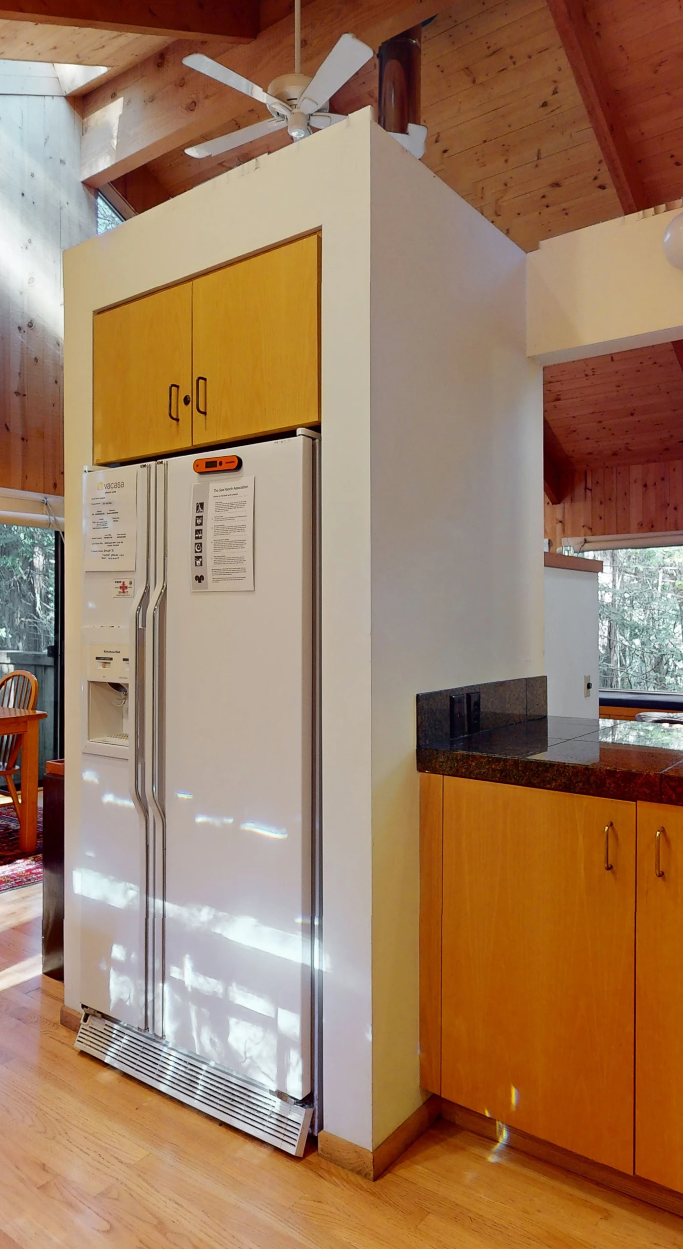 An open design of the kitchen flows seamlessly into the dining area, making it easy to entertain while enjoying the forest views.