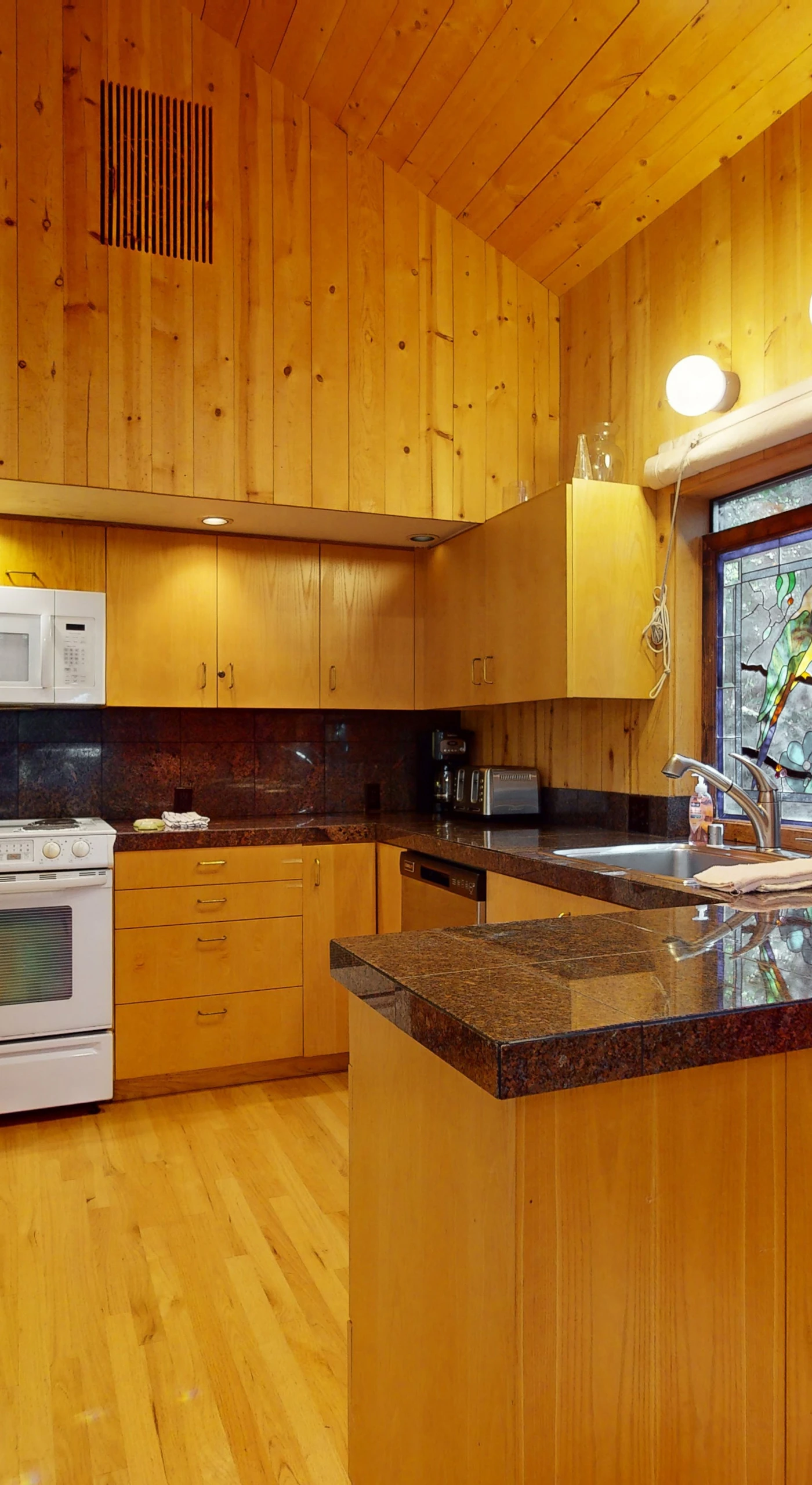 Unleash your inner chef in the modern kitchen, complete with ample counter space and all the essentials for crafting delicious meals together.
