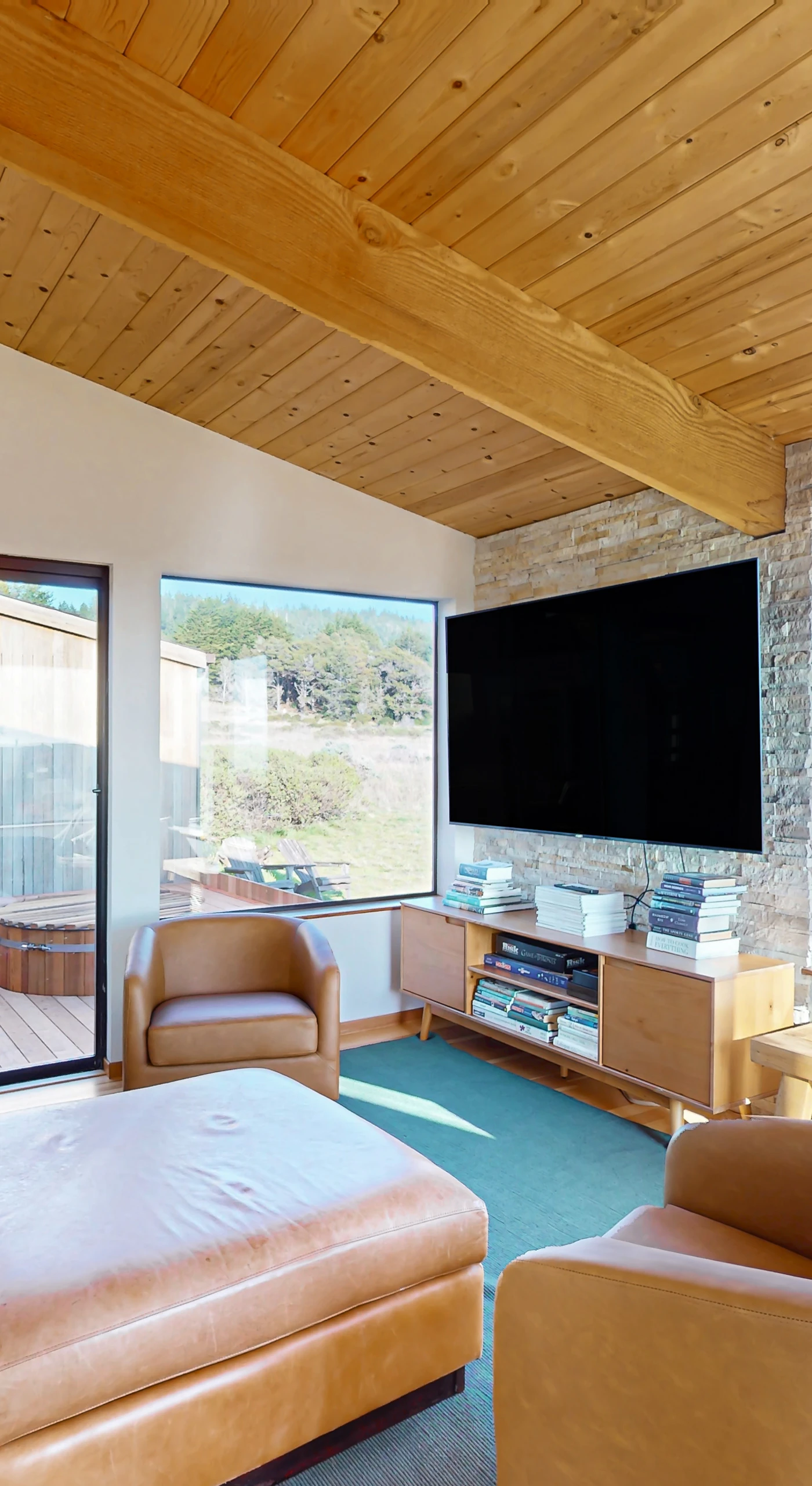 Gaze out at the serene landscape from this cozy nook, perfect for reading or enjoying a quiet moment with loved ones.