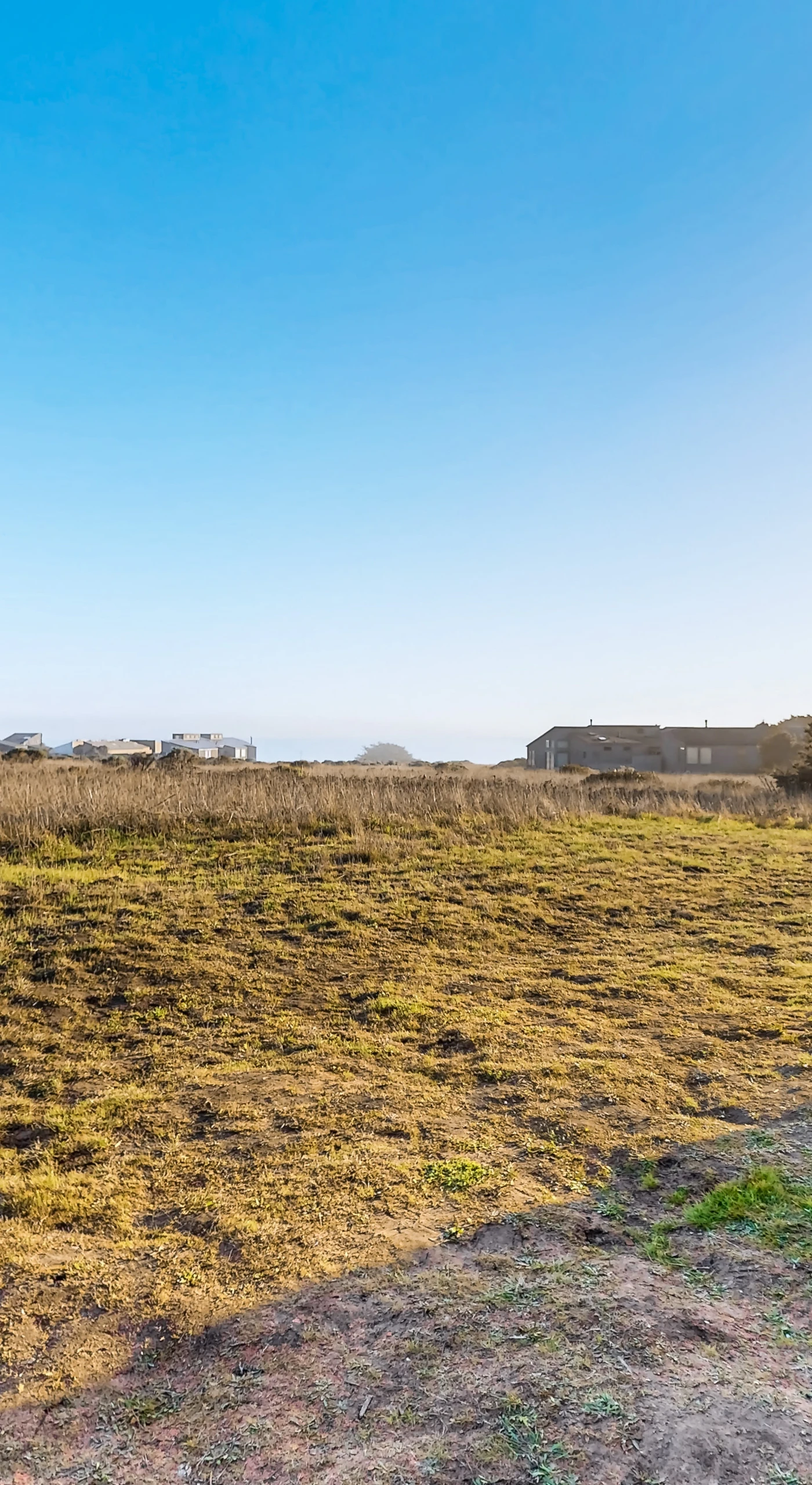 Gaze across the expansive landscape from this vantage point, where rolling hills meet the horizon, offering endless inspiration for exploration.