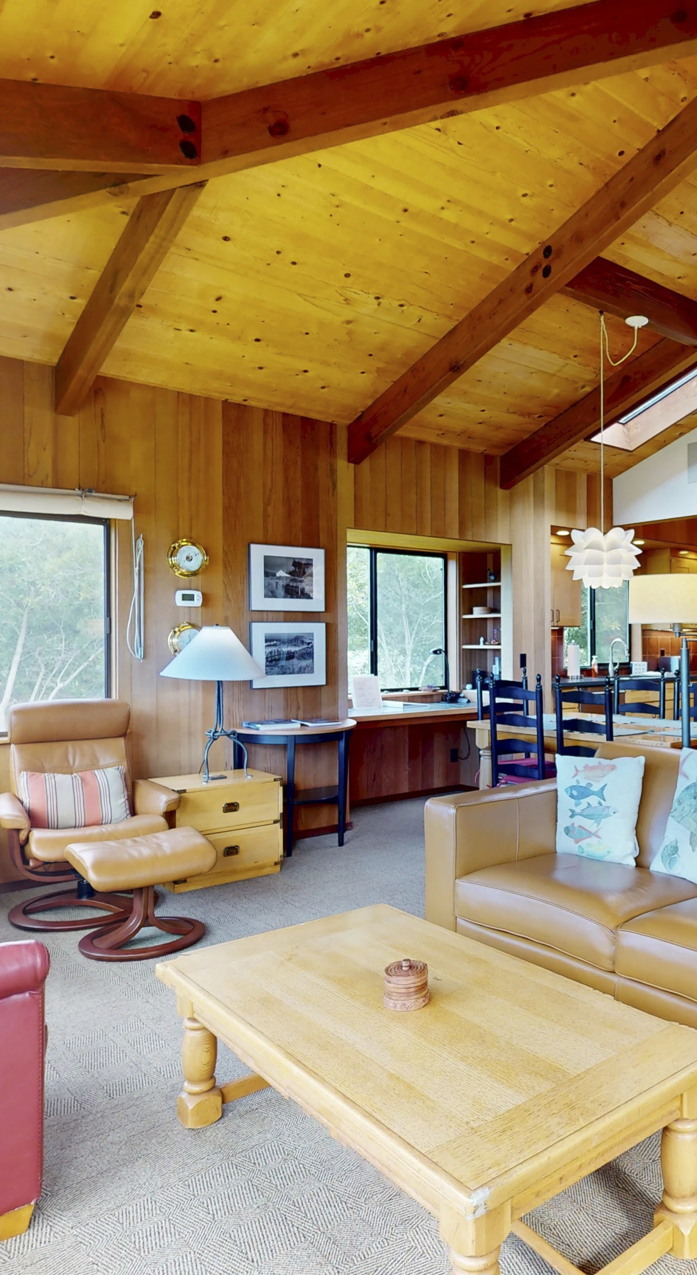 The inviting living area beckons you to gather with loved ones, featuring a warm ambiance and stunning natural light.