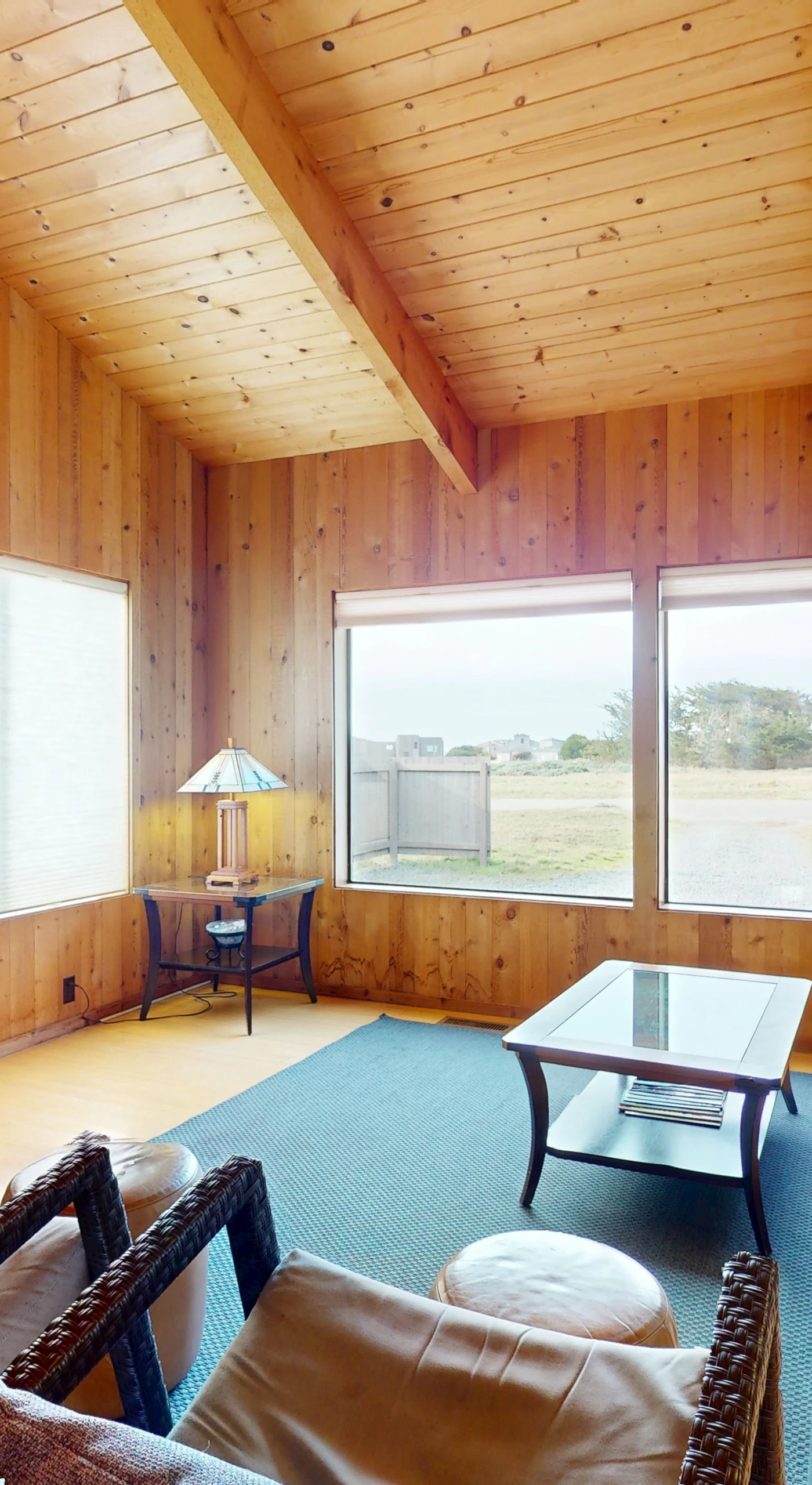 Morning light spills into the cozy living room, inviting you to relax and enjoy the tranquil ambiance of Sea Ranch.