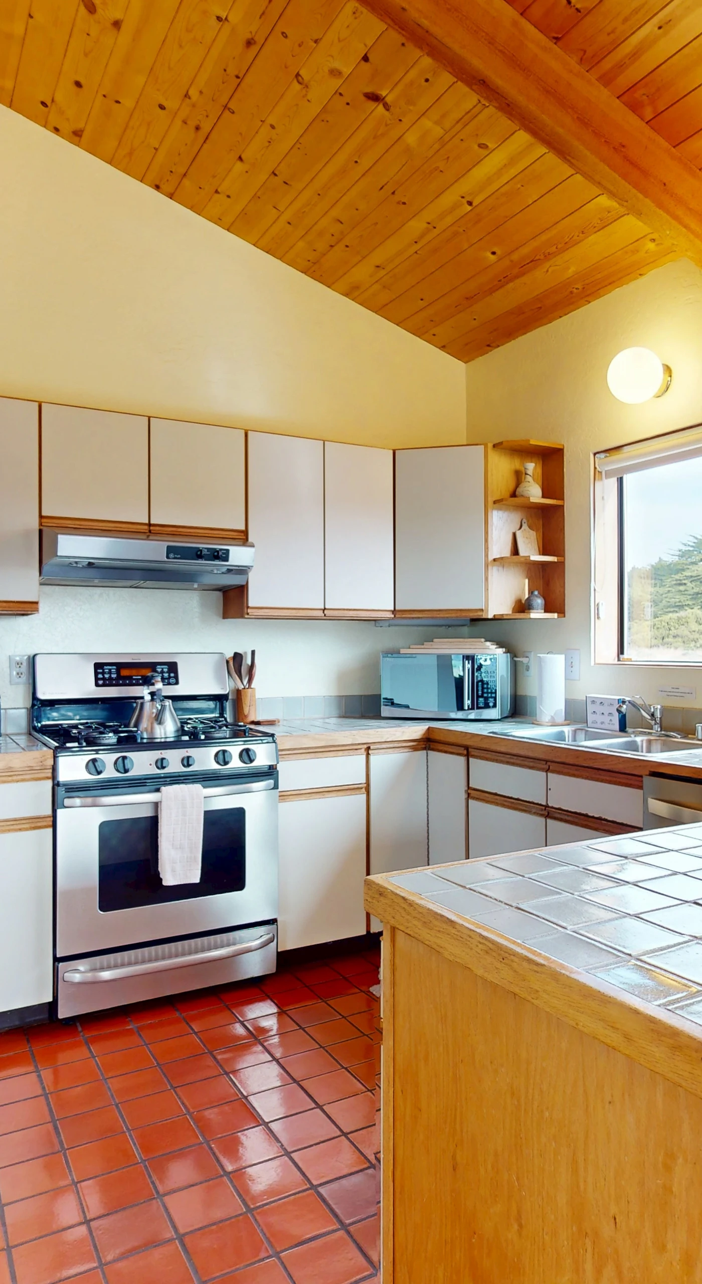 Cook up your favorite meals in the fully equipped kitchen, where modern amenities meet charming rustic details.
