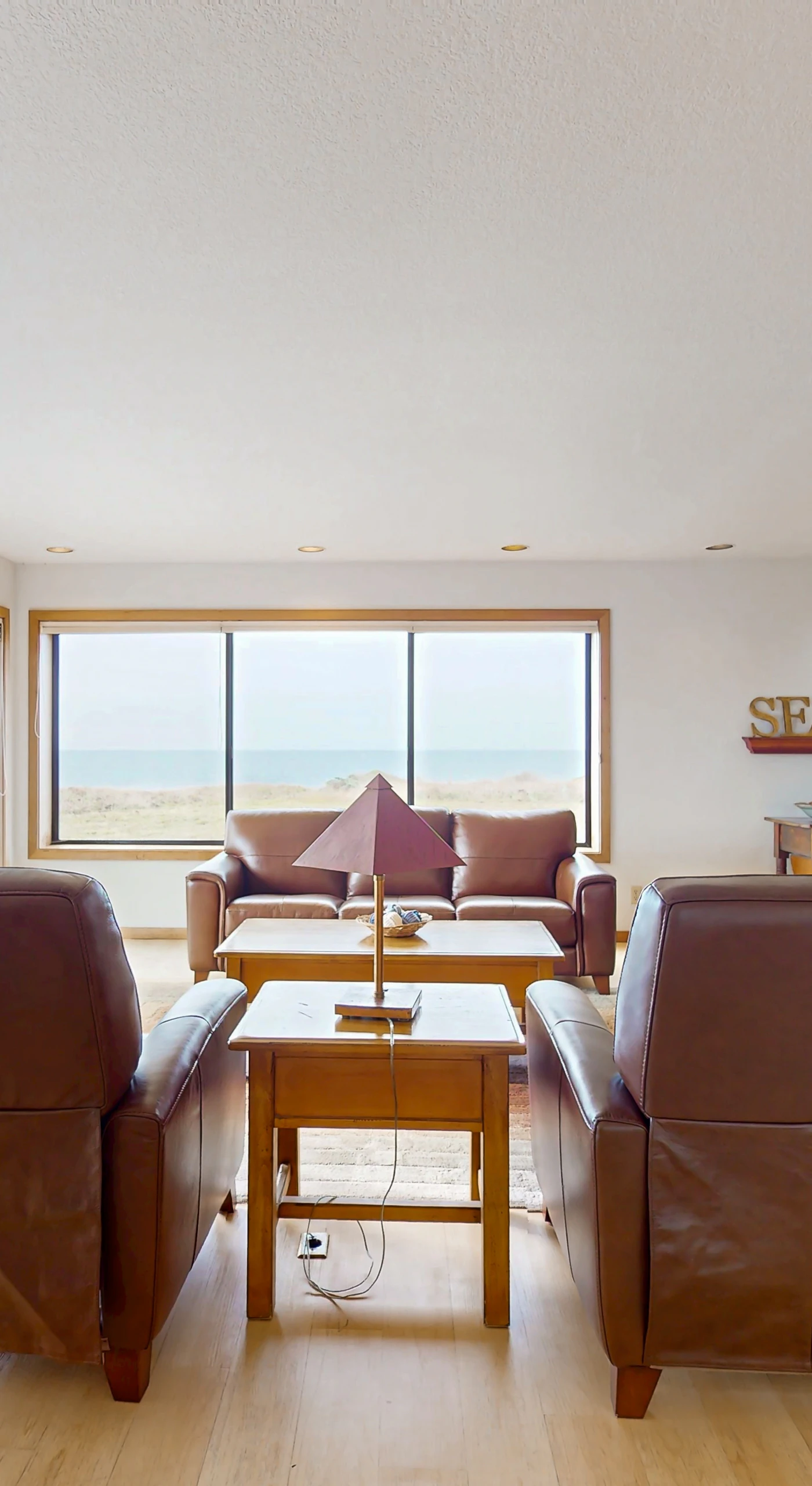Imagine sipping your evening drink while gazing at the ocean from your comfortable seating area—pure relaxation awaits.