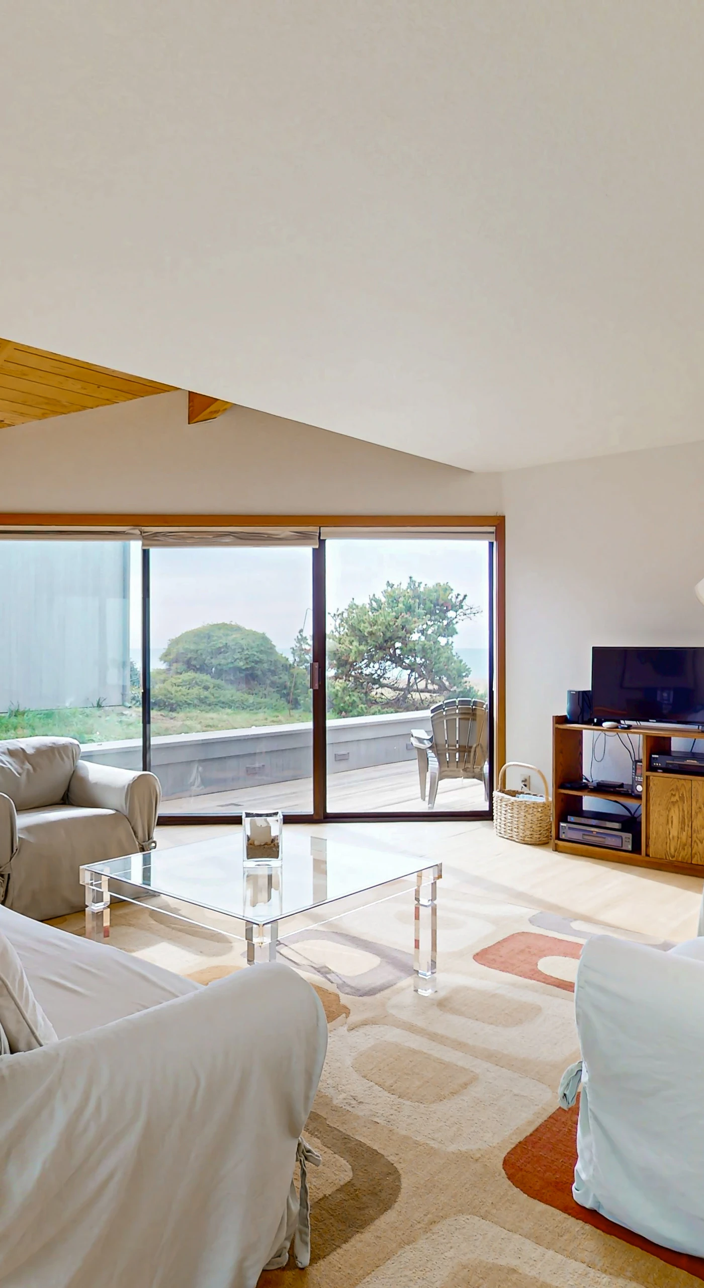 Morning light floods the spacious living room, inviting you to relax and enjoy the serene surroundings with family and friends.