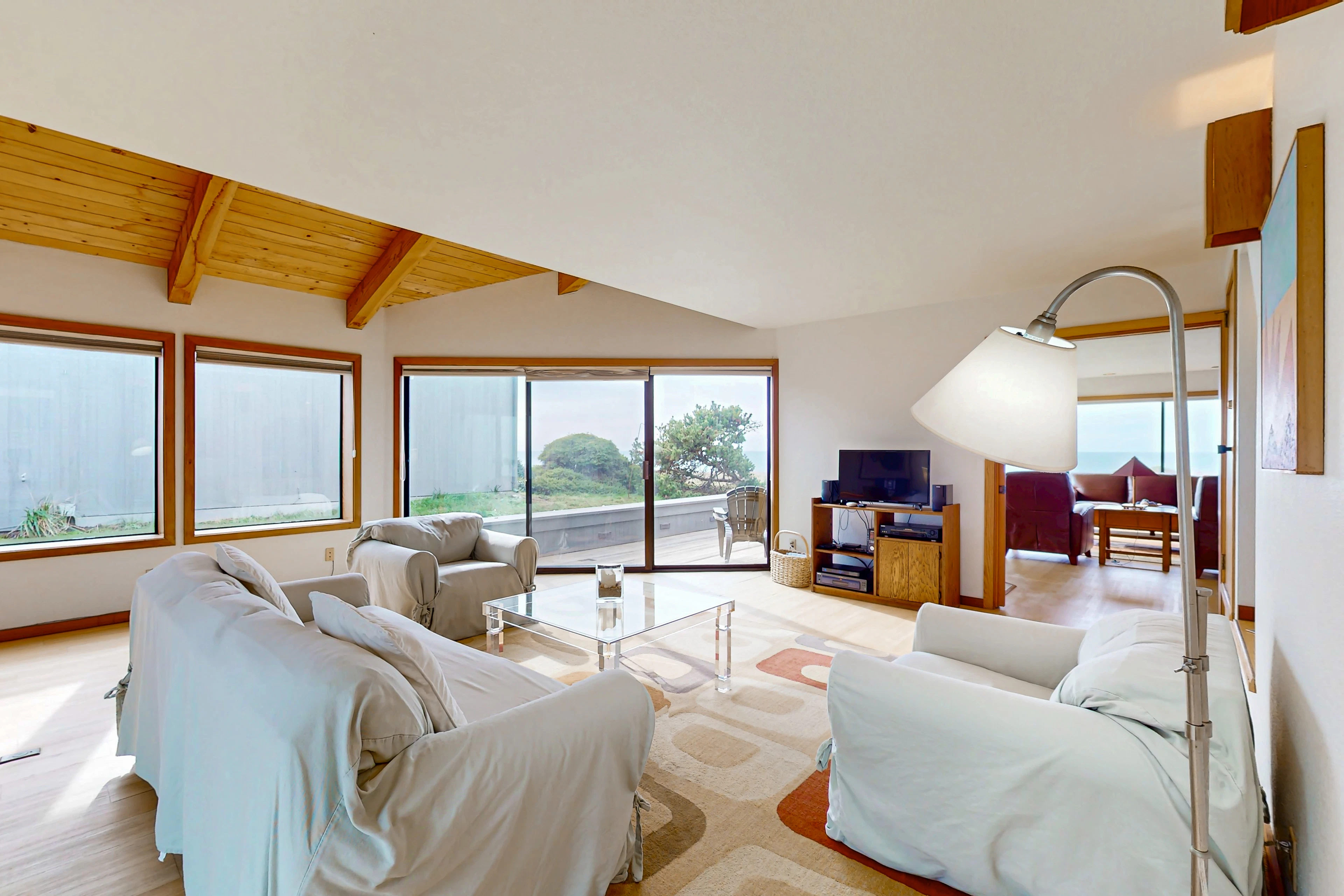 Morning light floods the spacious living room, inviting you to relax and enjoy the serene surroundings with family and friends.