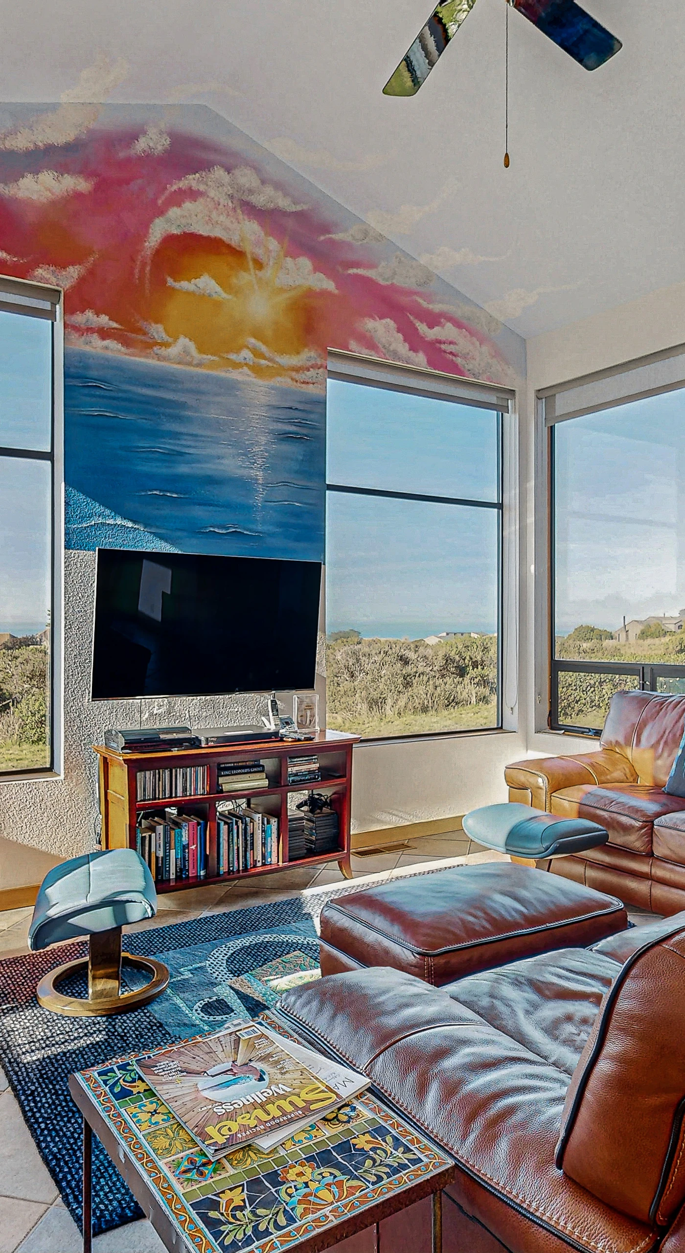 Bask in panoramic ocean views through expansive windows, filling your living space with light and serenity.
