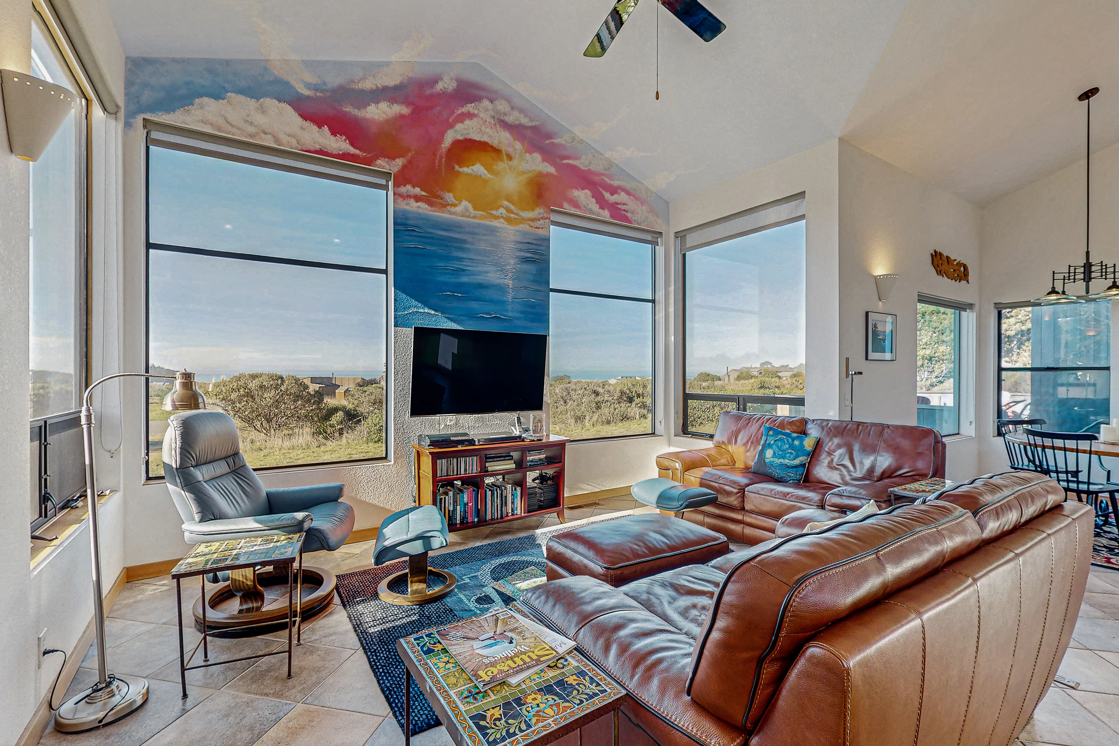 Bask in panoramic ocean views through expansive windows, filling your living space with light and serenity.