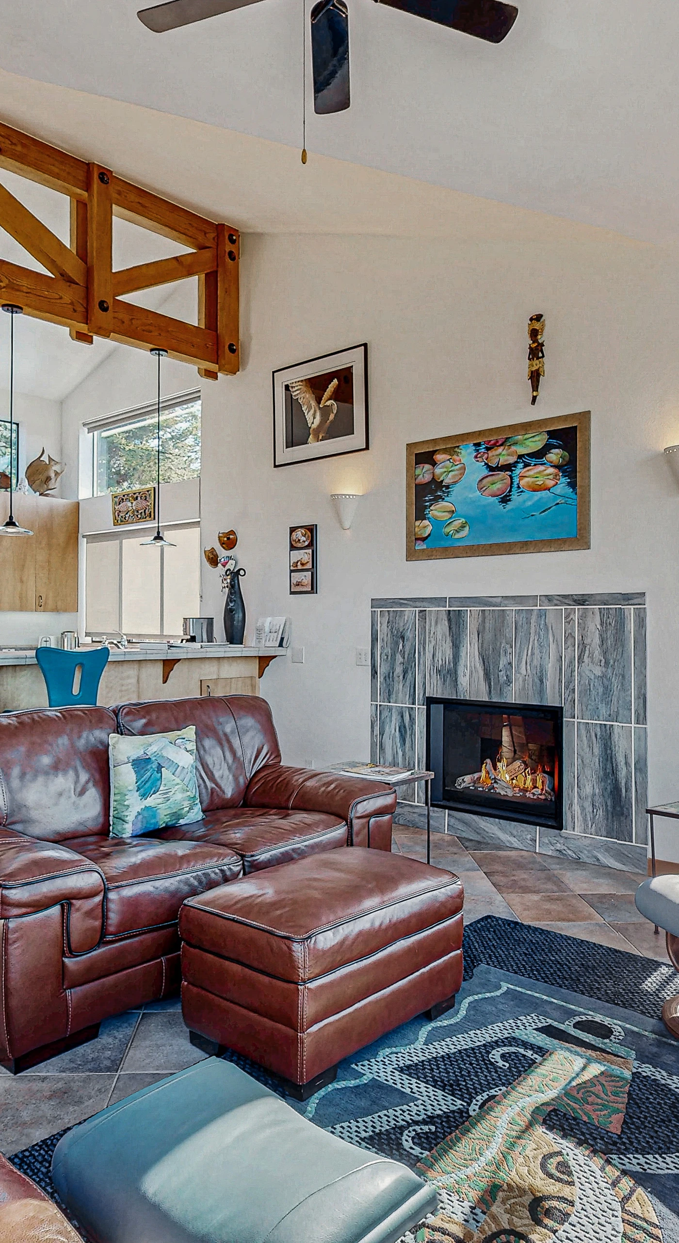 Gather around the gas fireplace in your inviting living room, where comfort meets coastal charm for memorable evenings.