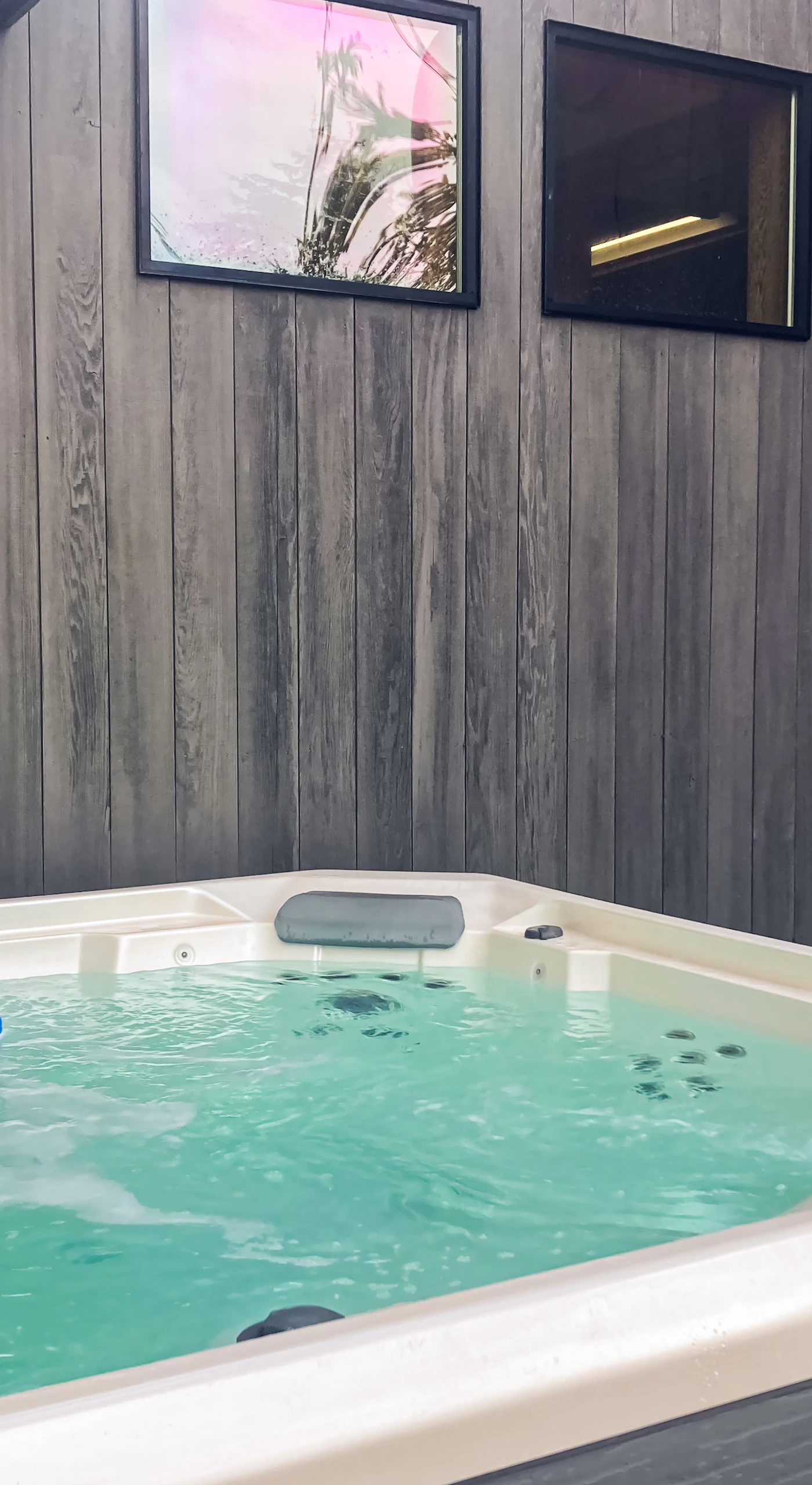 Soak your cares away in the private hot tub, nestled in a serene outdoor setting, ideal for stargazing on clear nights.