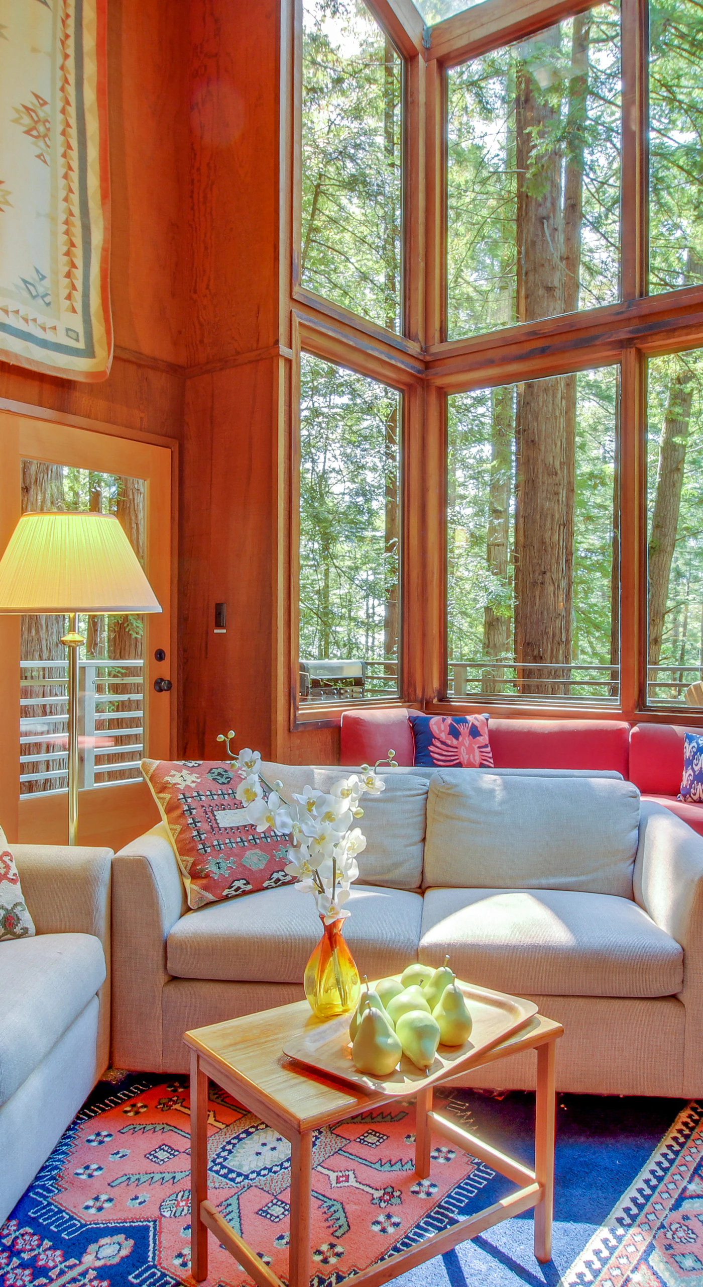 Gather with loved ones in this warm living space, designed for comfort and filled with natural light.