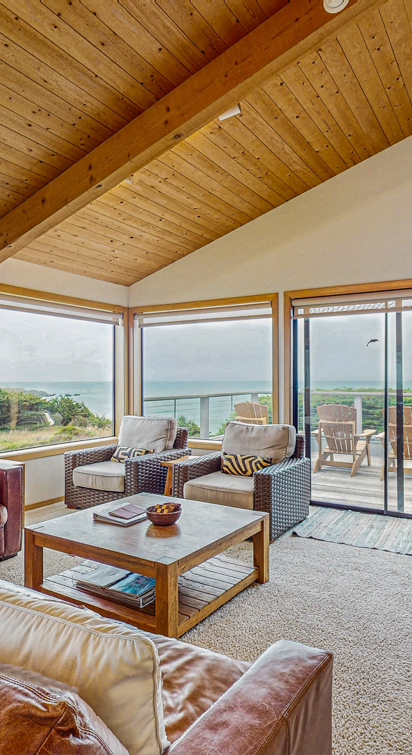Let ocean views captivate you from the comfort of the living room, a perfect backdrop for your coastal getaway.