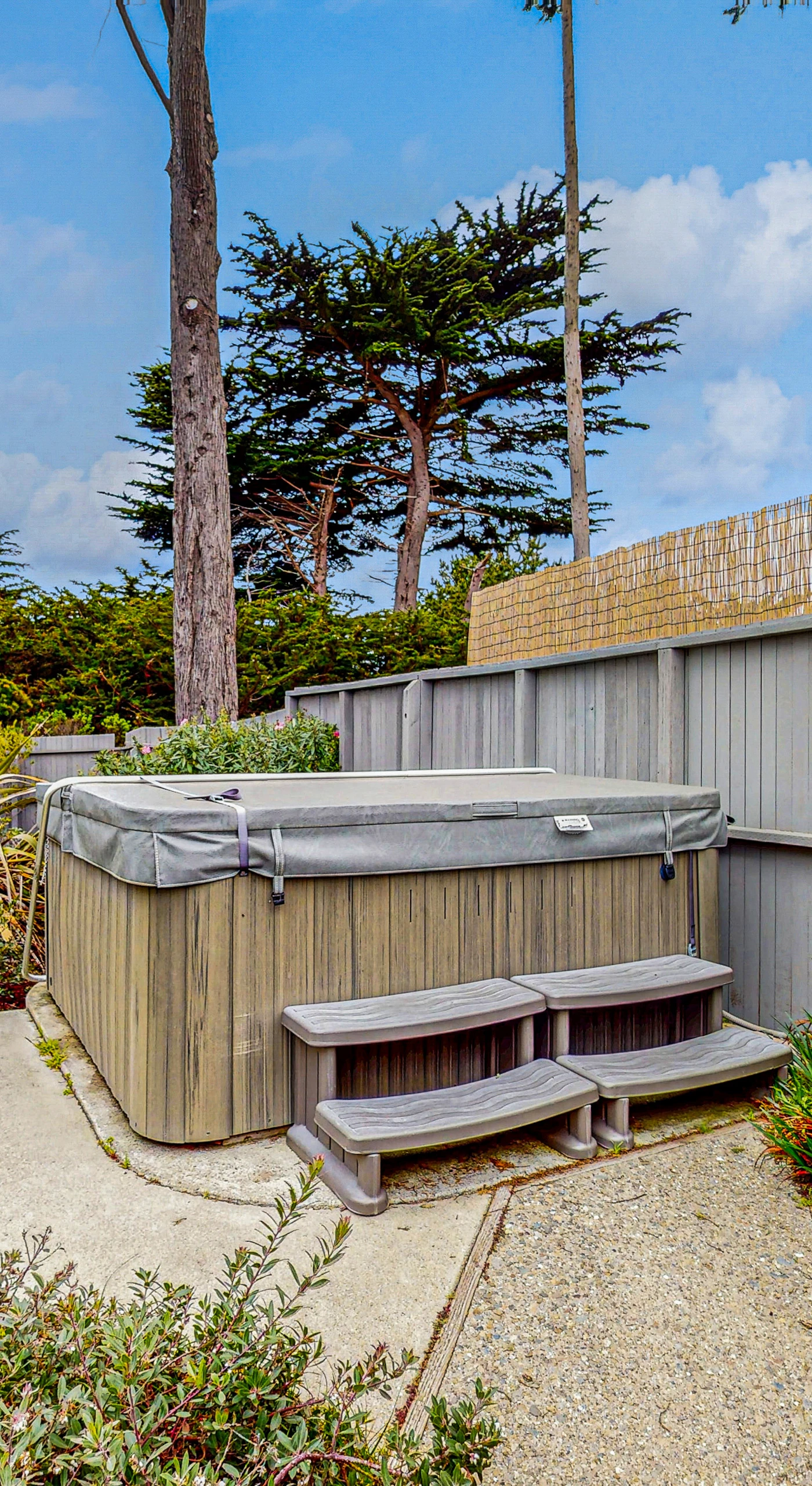 Soak in your private hot tub under the stars, the perfect spot to unwind after a day of coastal adventures.