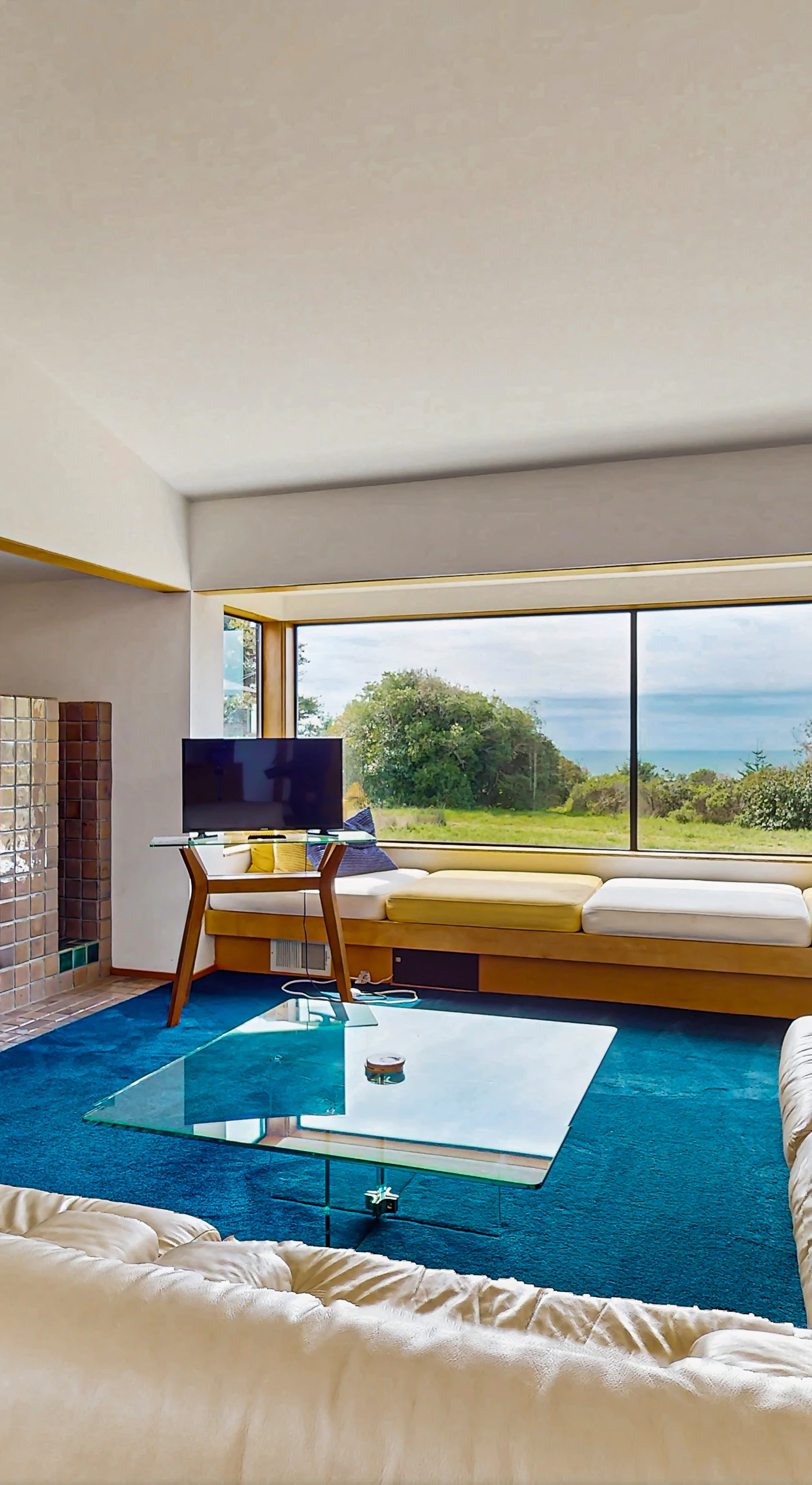 Gaze out at the ocean from your cozy nook; this serene space is designed for both relaxation and connection.