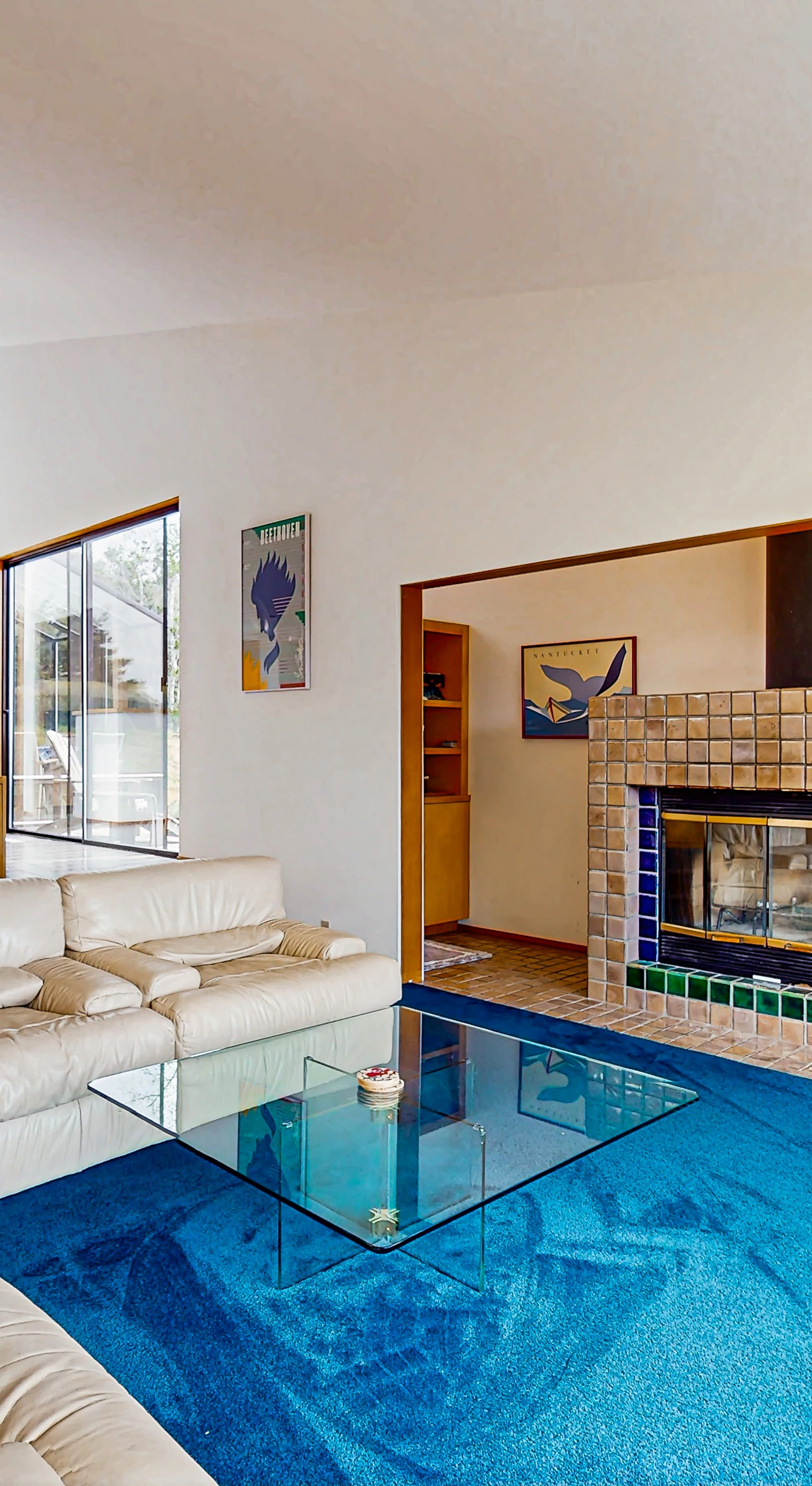 Experience comfort and warmth in this inviting living space, where the fireplace sets the mood for cozy evenings.