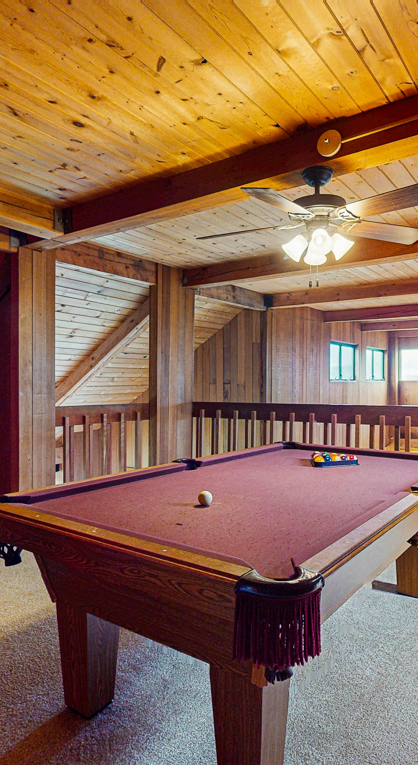 Challenge your friends to a game of pool in the cozy game room, perfect for friendly competition.