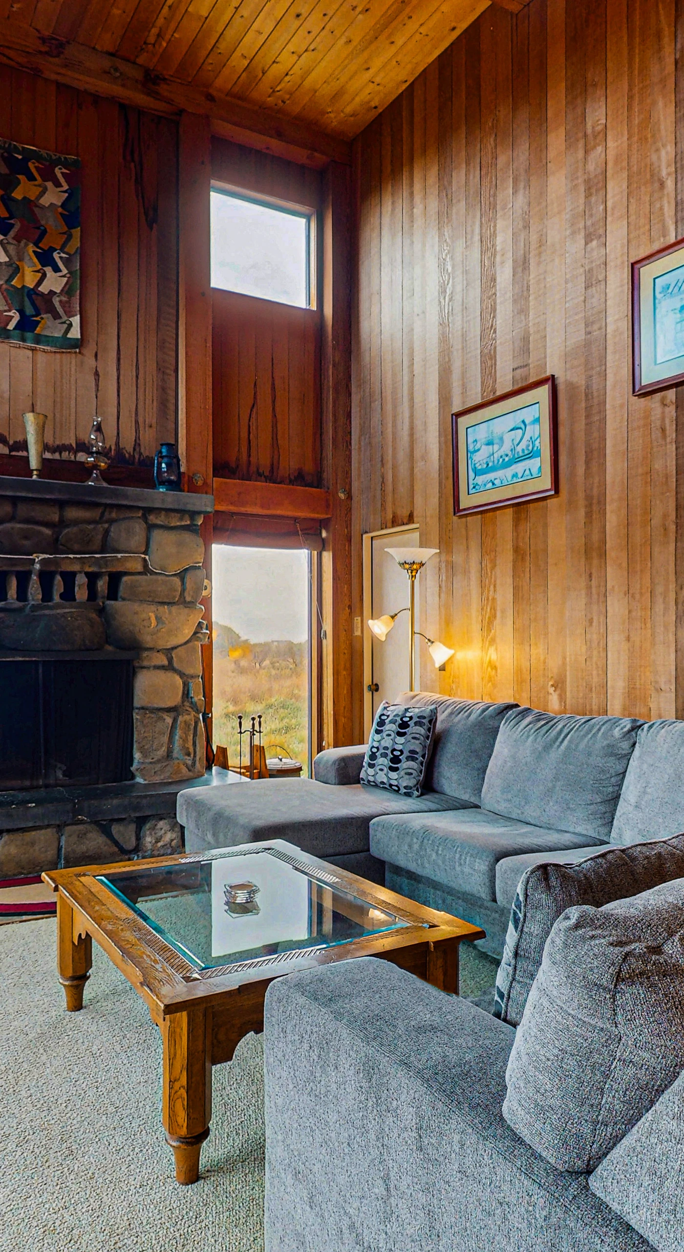 Gather around the wood-burning fireplace in the spacious living room, where warmth and relaxation await.