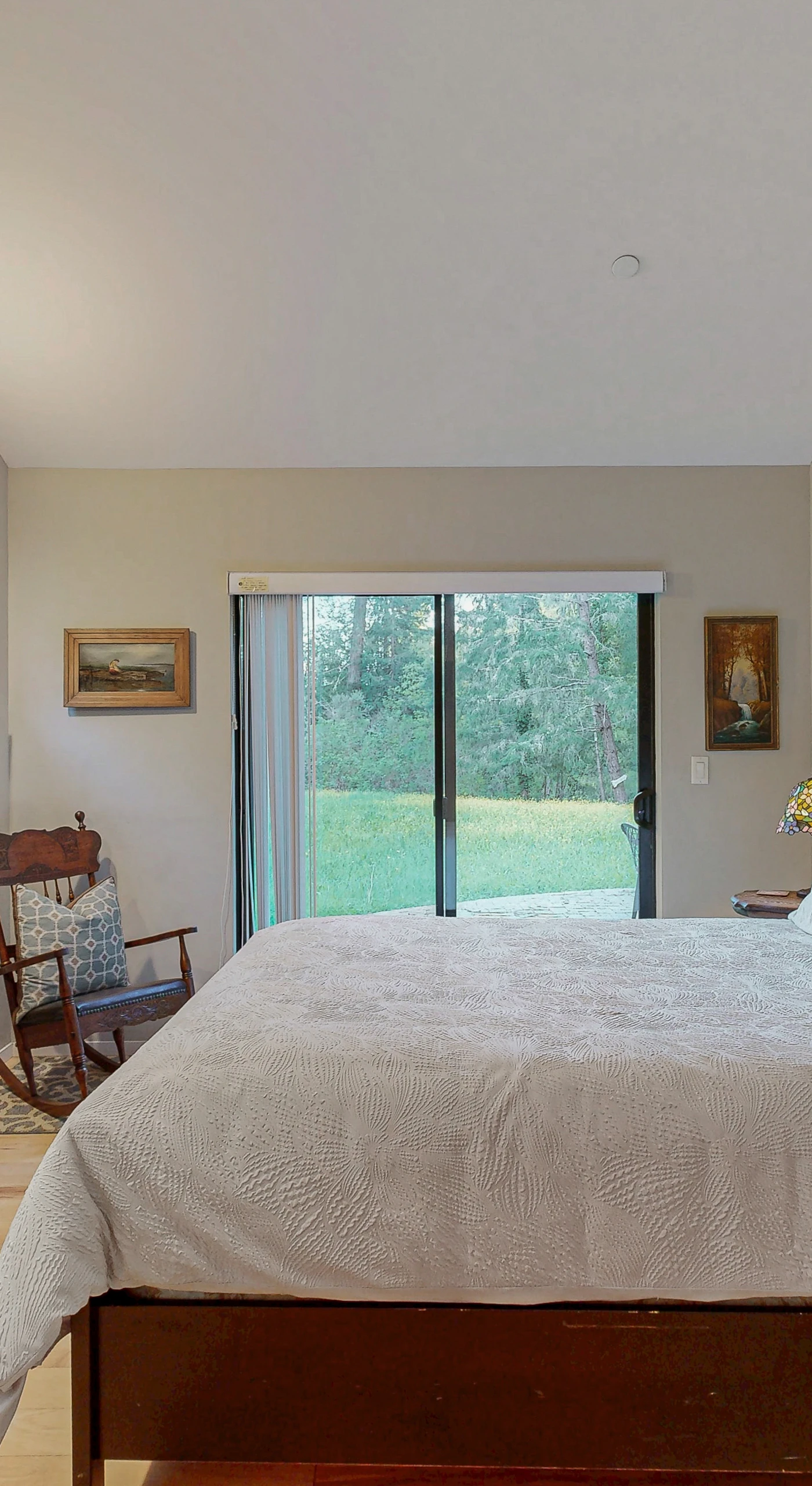 Retreat to your serene master bedroom with a queen bed and sliding glass doors that open to the private garden.