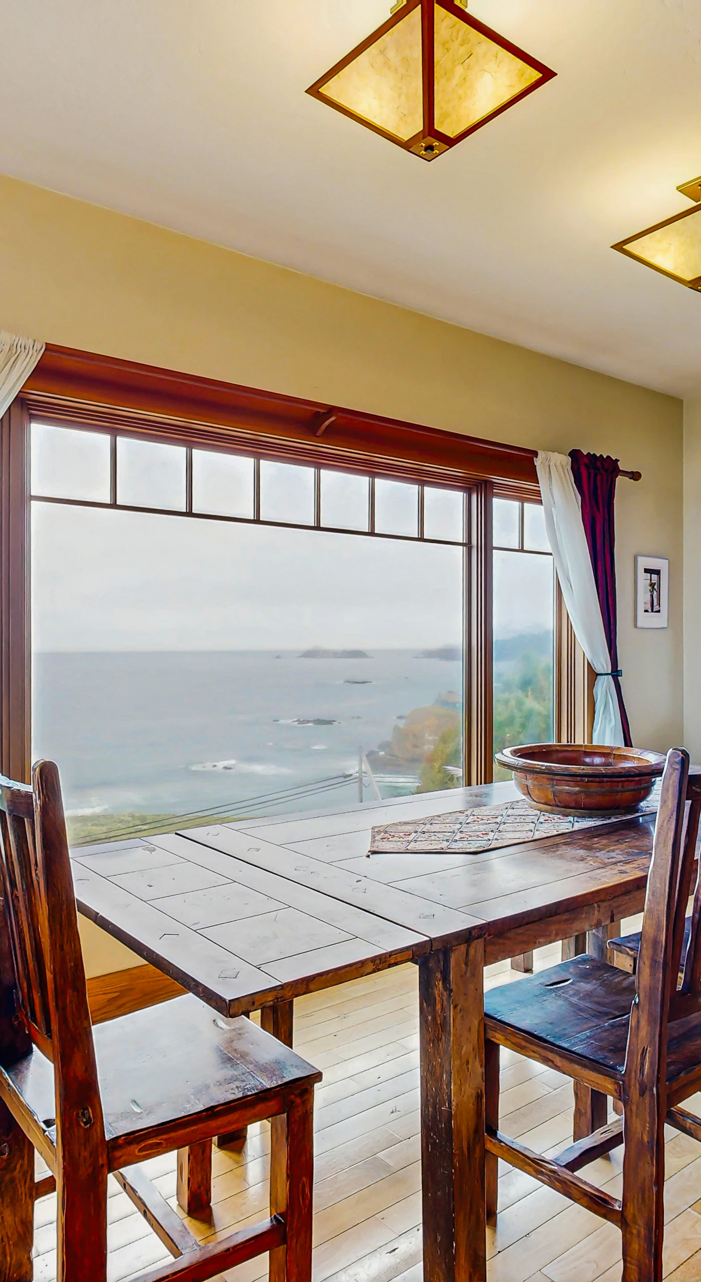 Dine with a view in this charming dining area, where the ocean backdrop adds a special touch to every meal shared with loved ones.