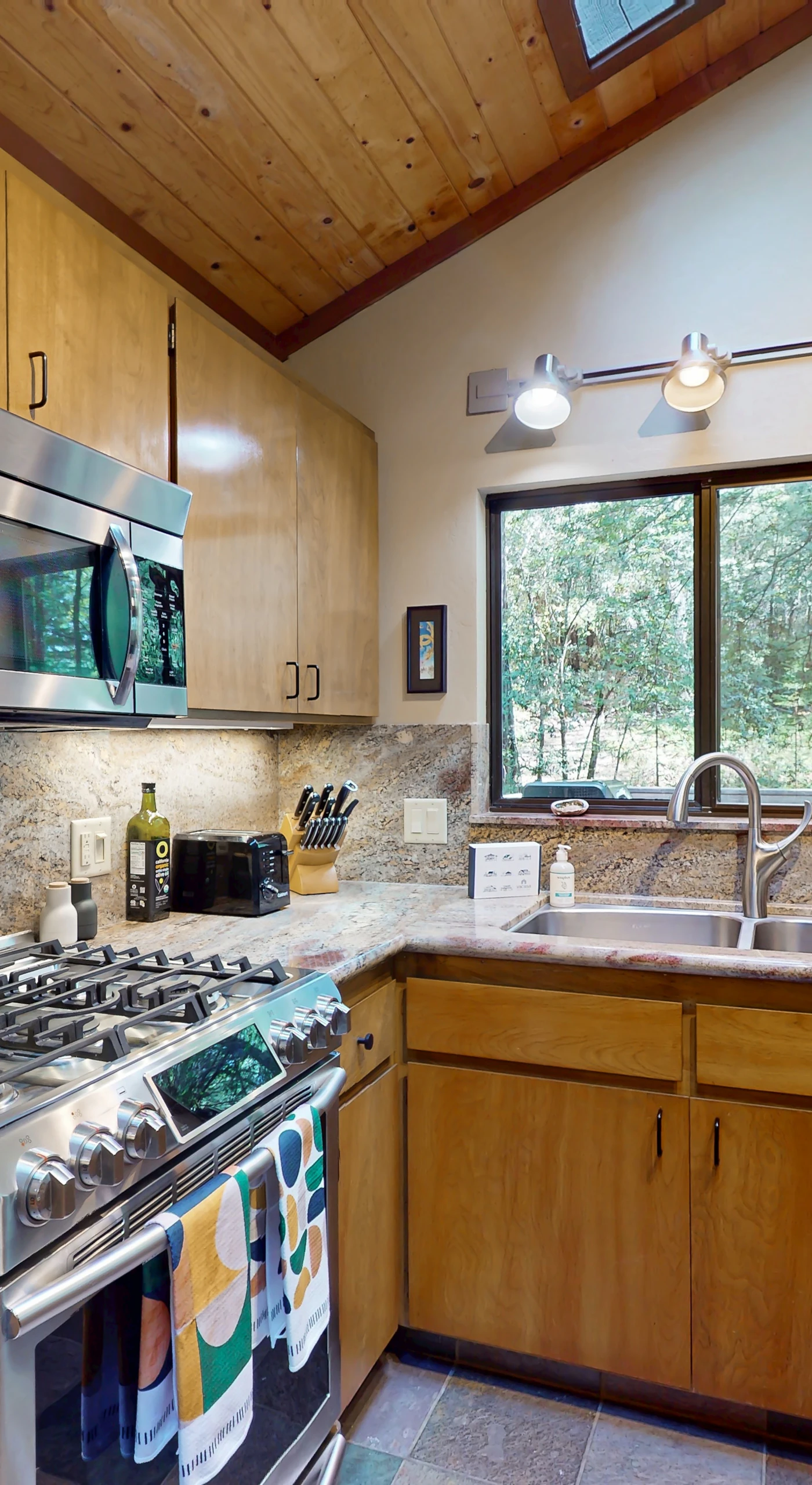 High-end appliances and ample counter space invite you to create your favorite dishes while enjoying the serene forest views.