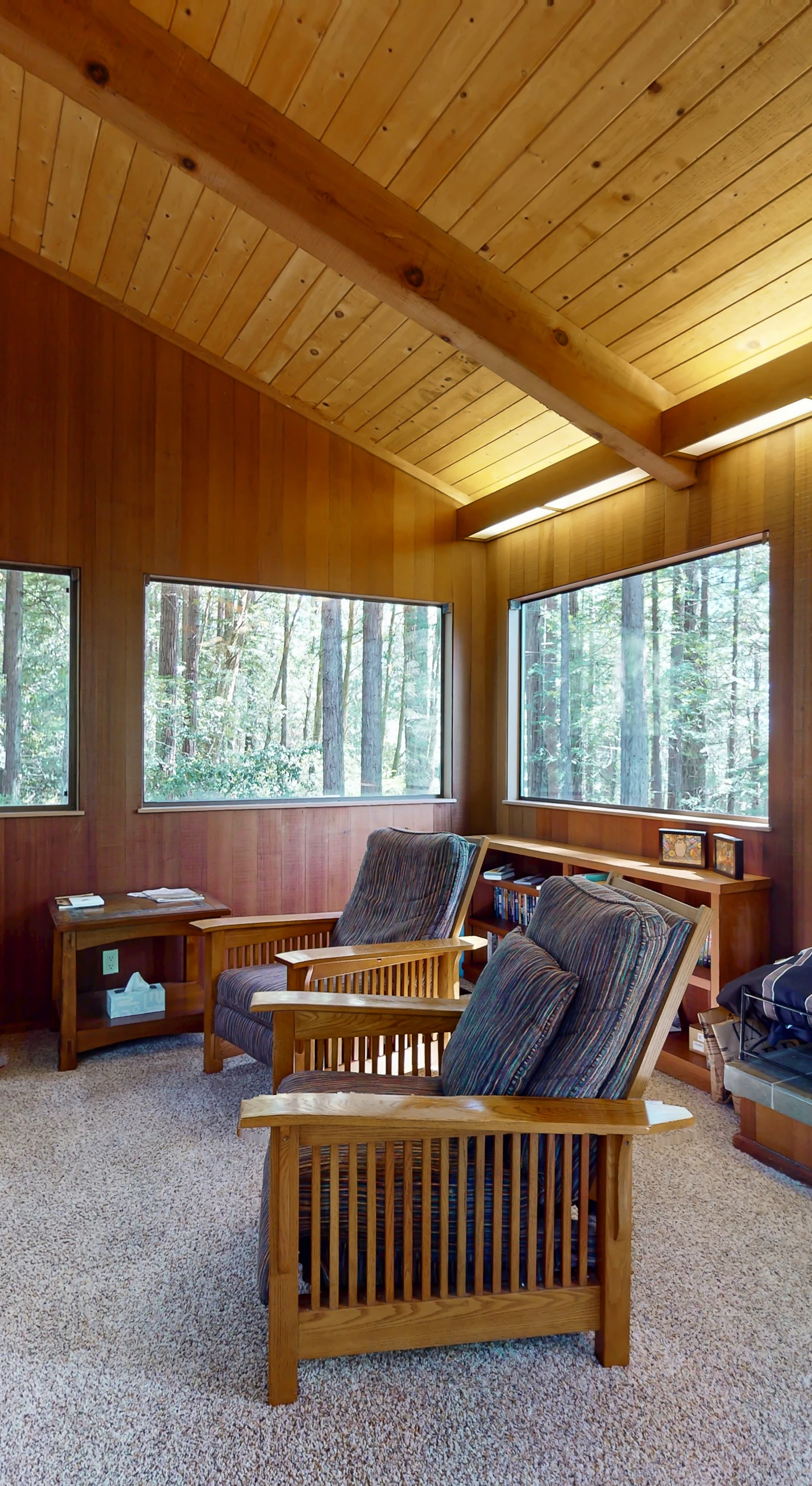 Gather around the fireplace in this tranquil living room, where cozy evenings and good conversation come naturally.