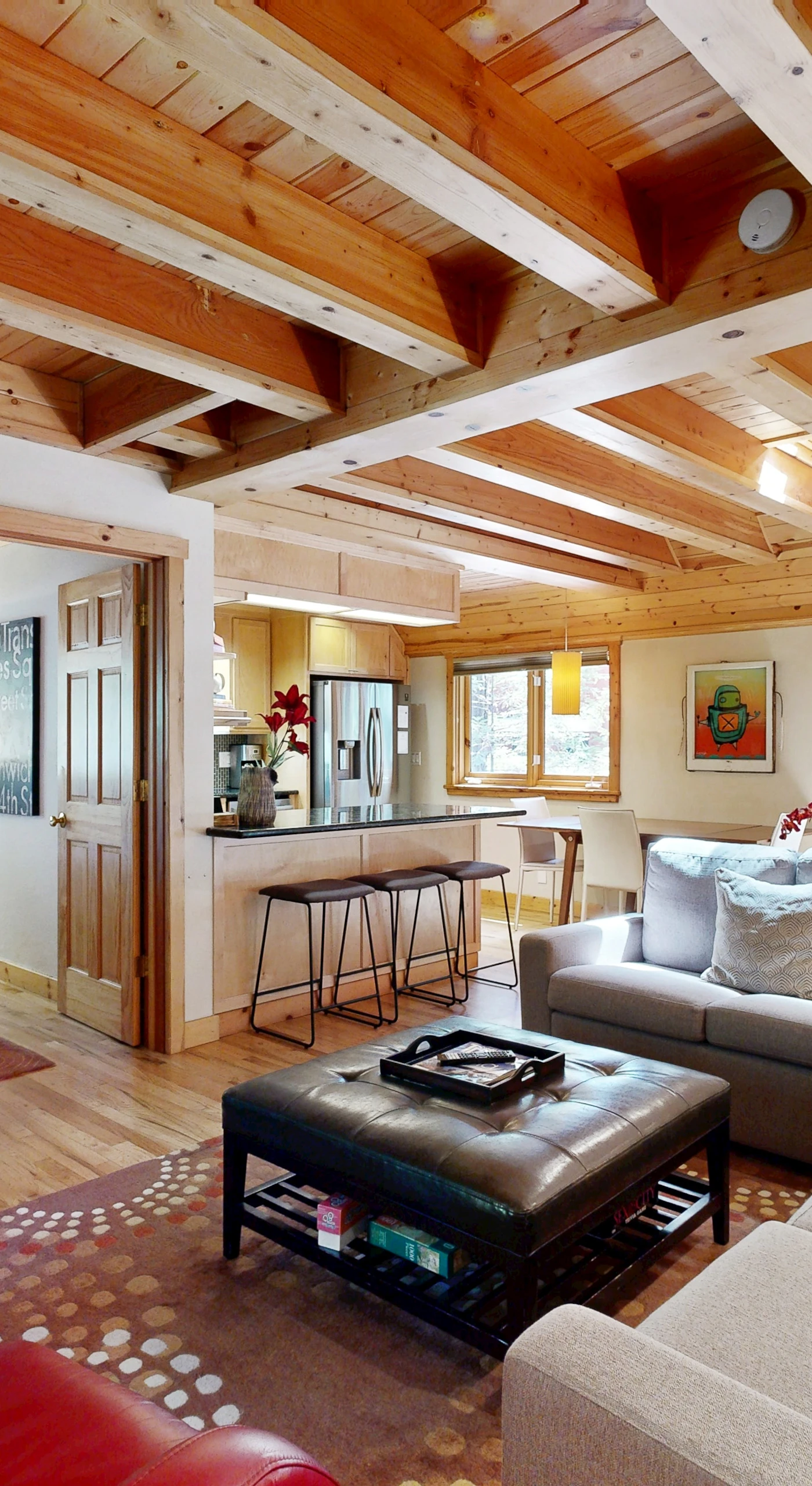 Spread out in your open-concept living space where warm wood beams, hardwood floors, and natural light create an effortless Sonoma wine country basecamp.